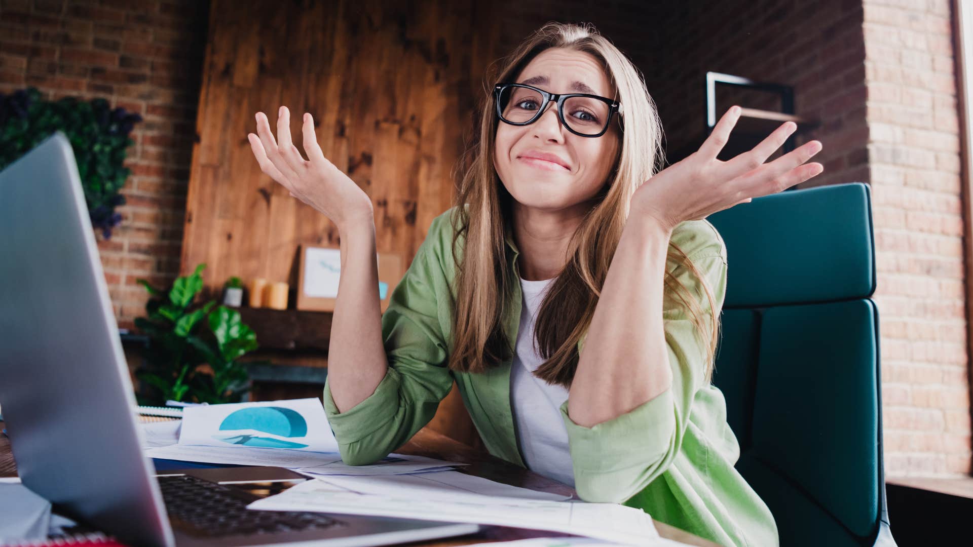woman shrugging and saying I don't know at work
