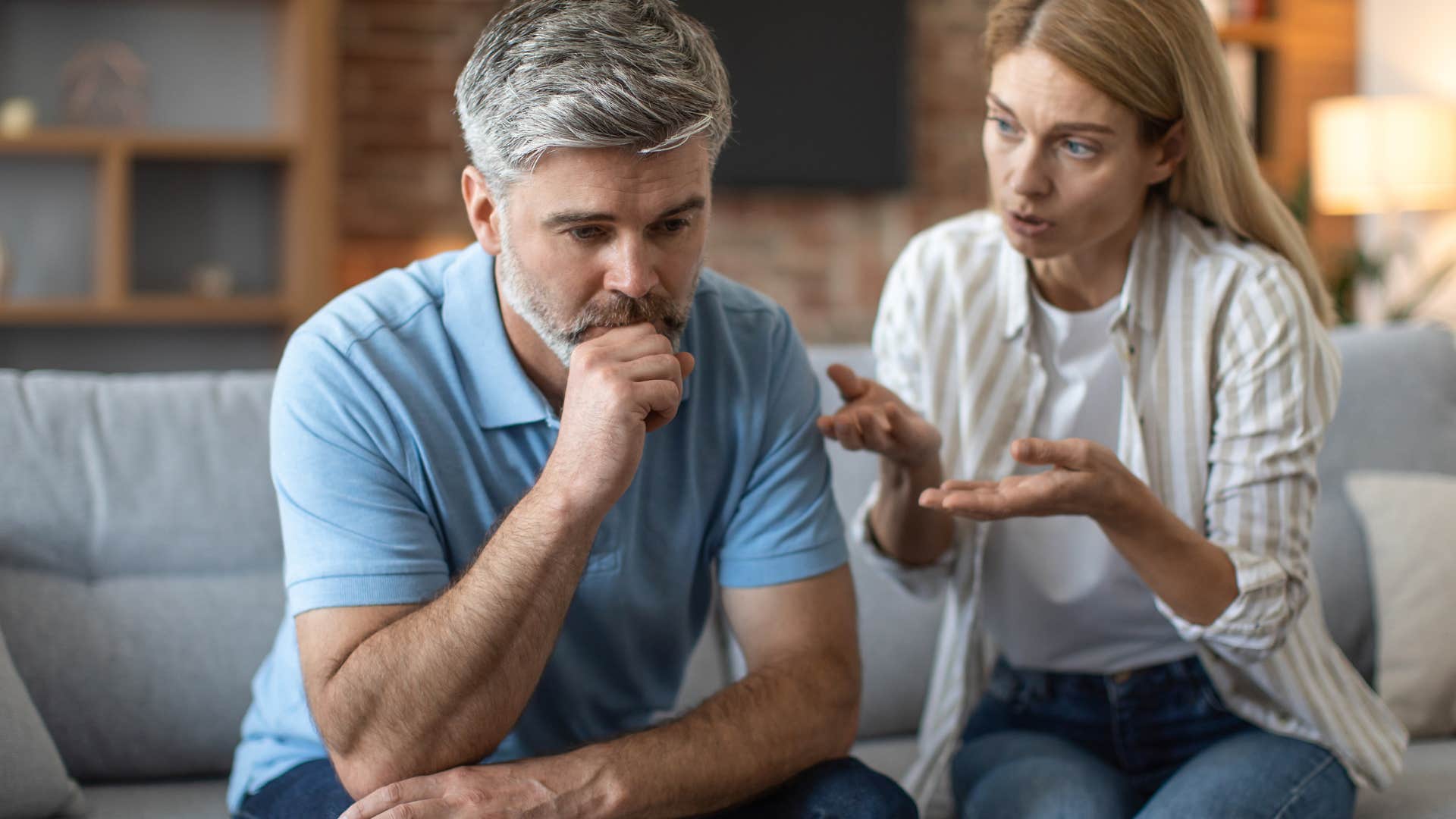 man saying I'm fine next to his angry wife