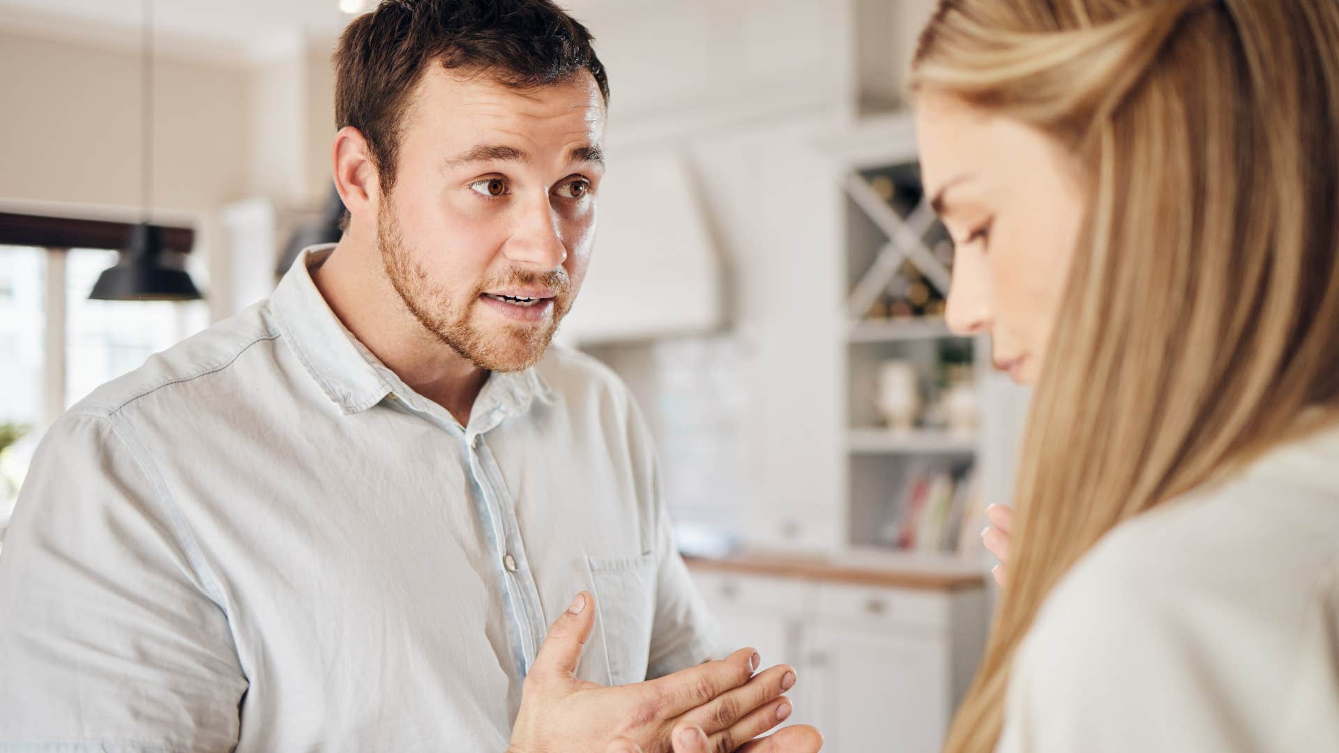 man saying you're overreacting to his upset wife