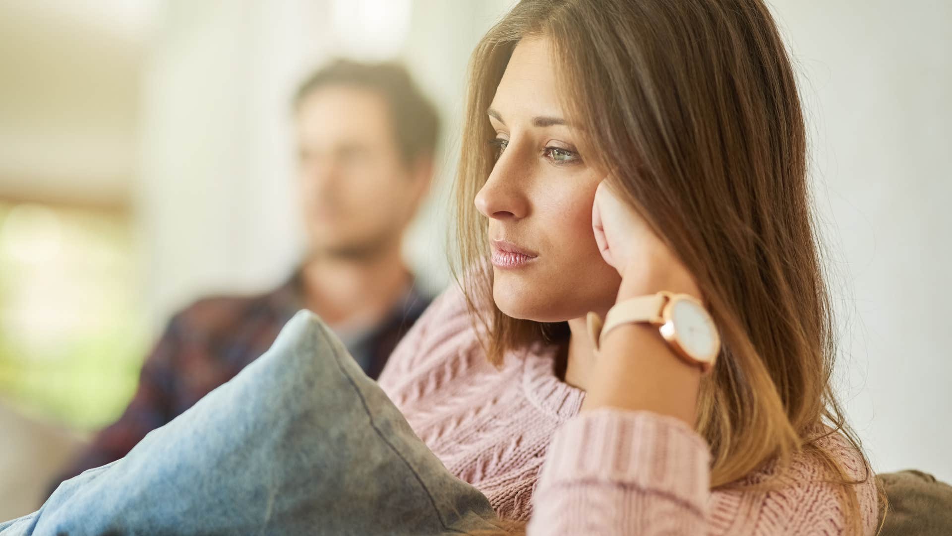 woman thinking you sound crazy turned away from her partner