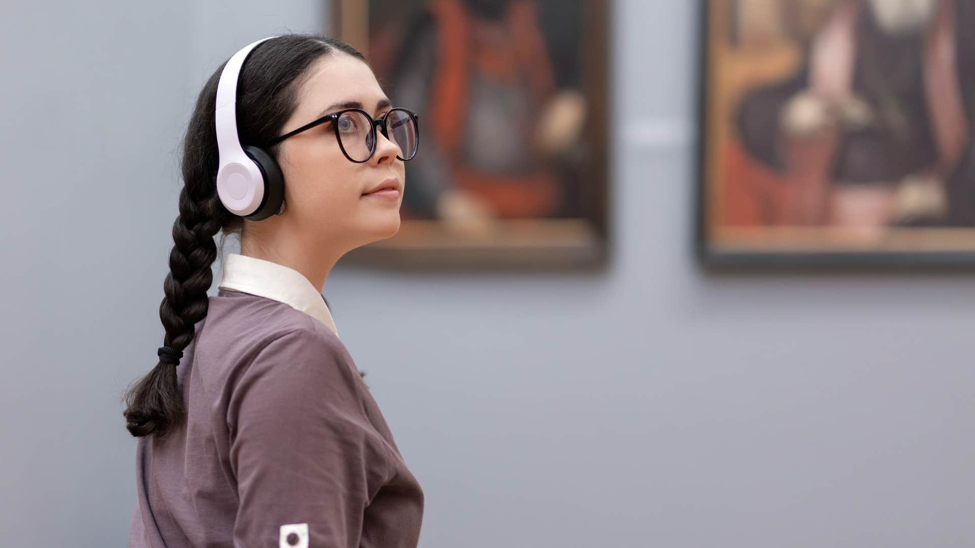 extremely smart woman learning about history at a museum