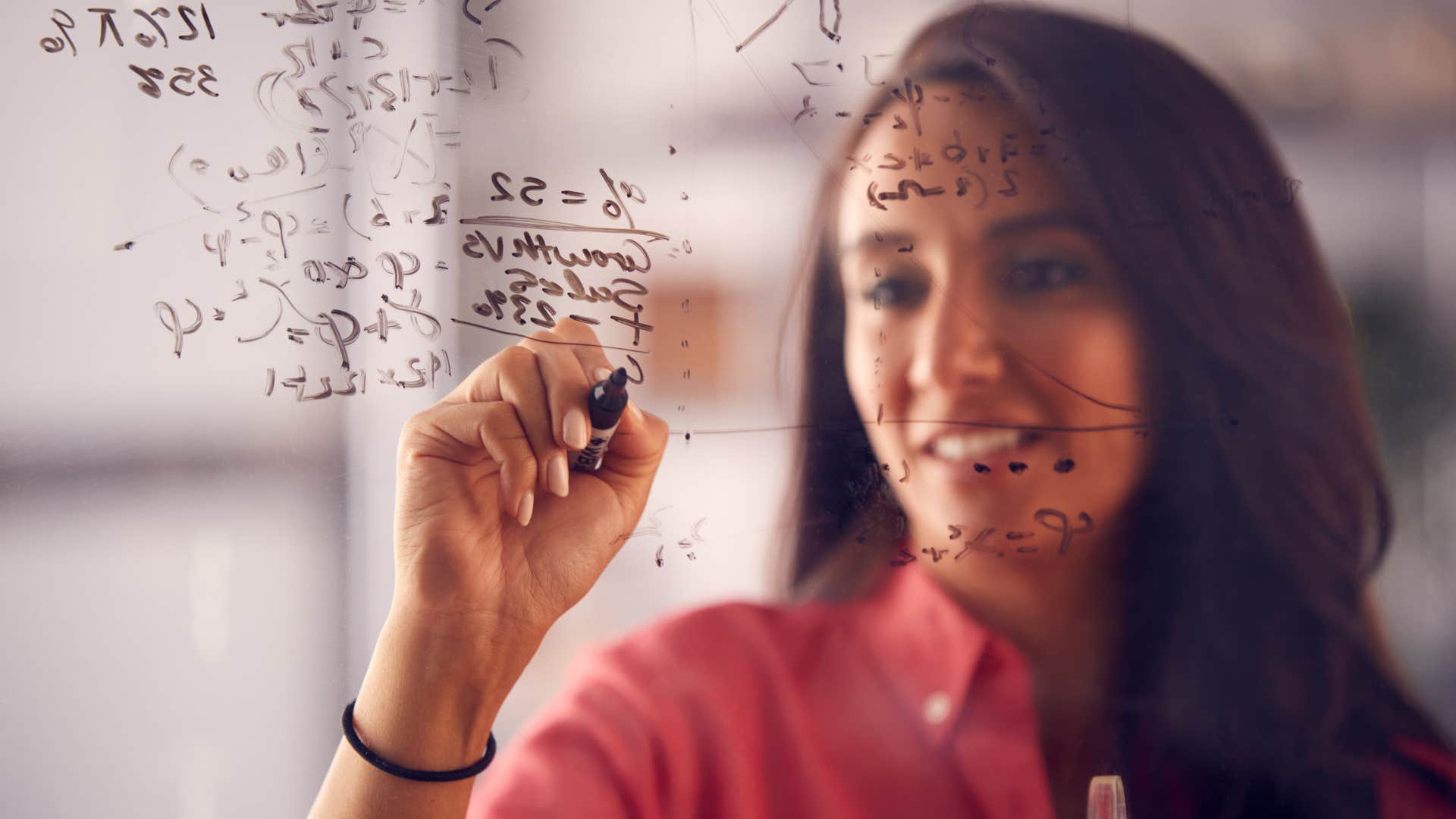 extremely smart woman solving math problems