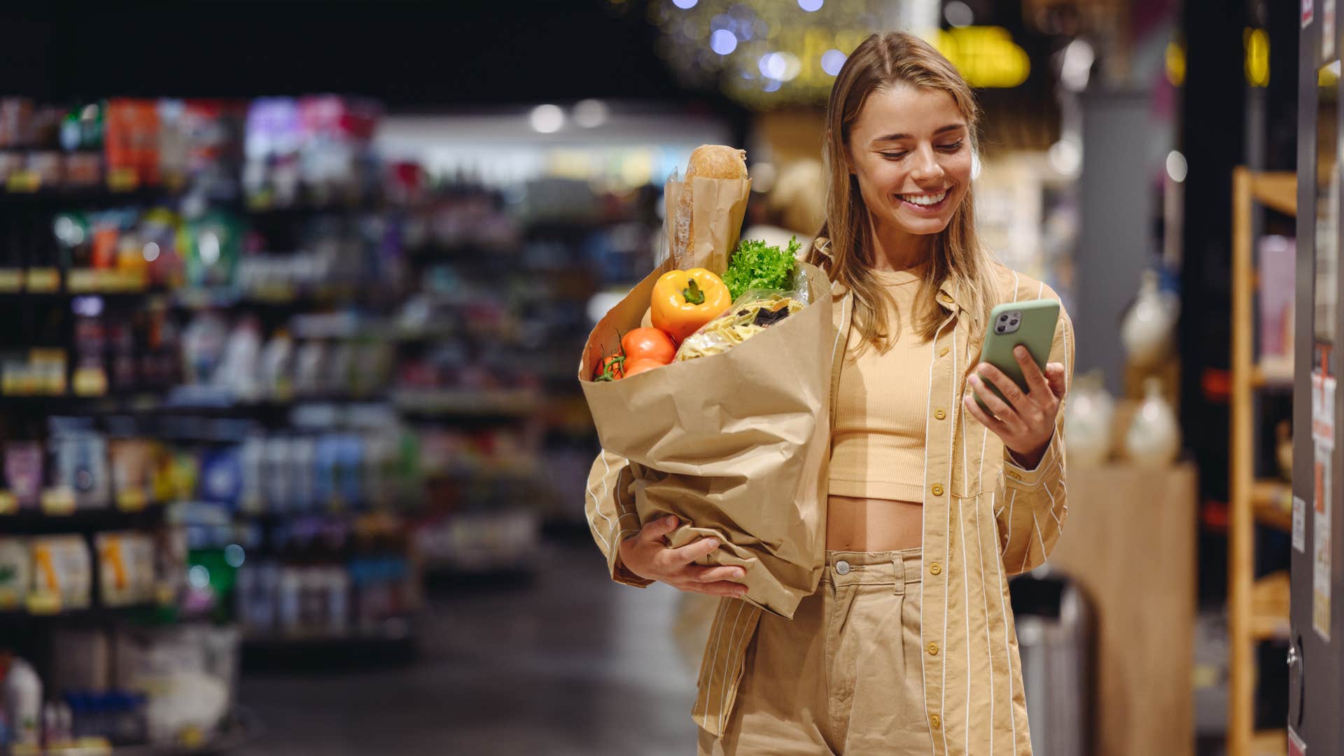 hungry woman checking out with groceries