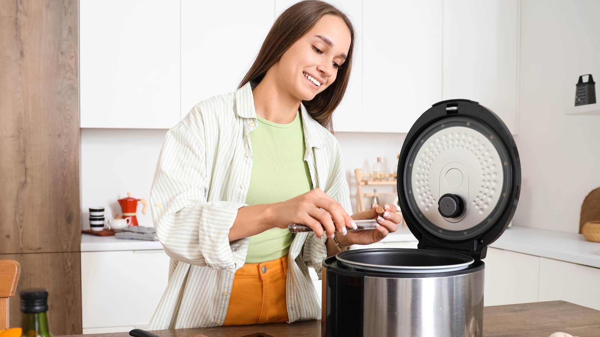 woman cooking food in a crockpot