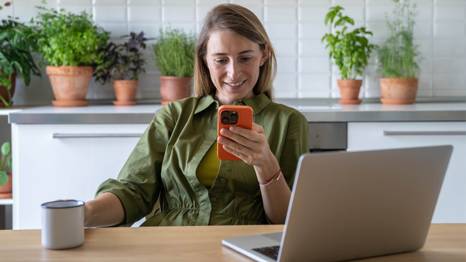 frugal woman using her outdated cellphone