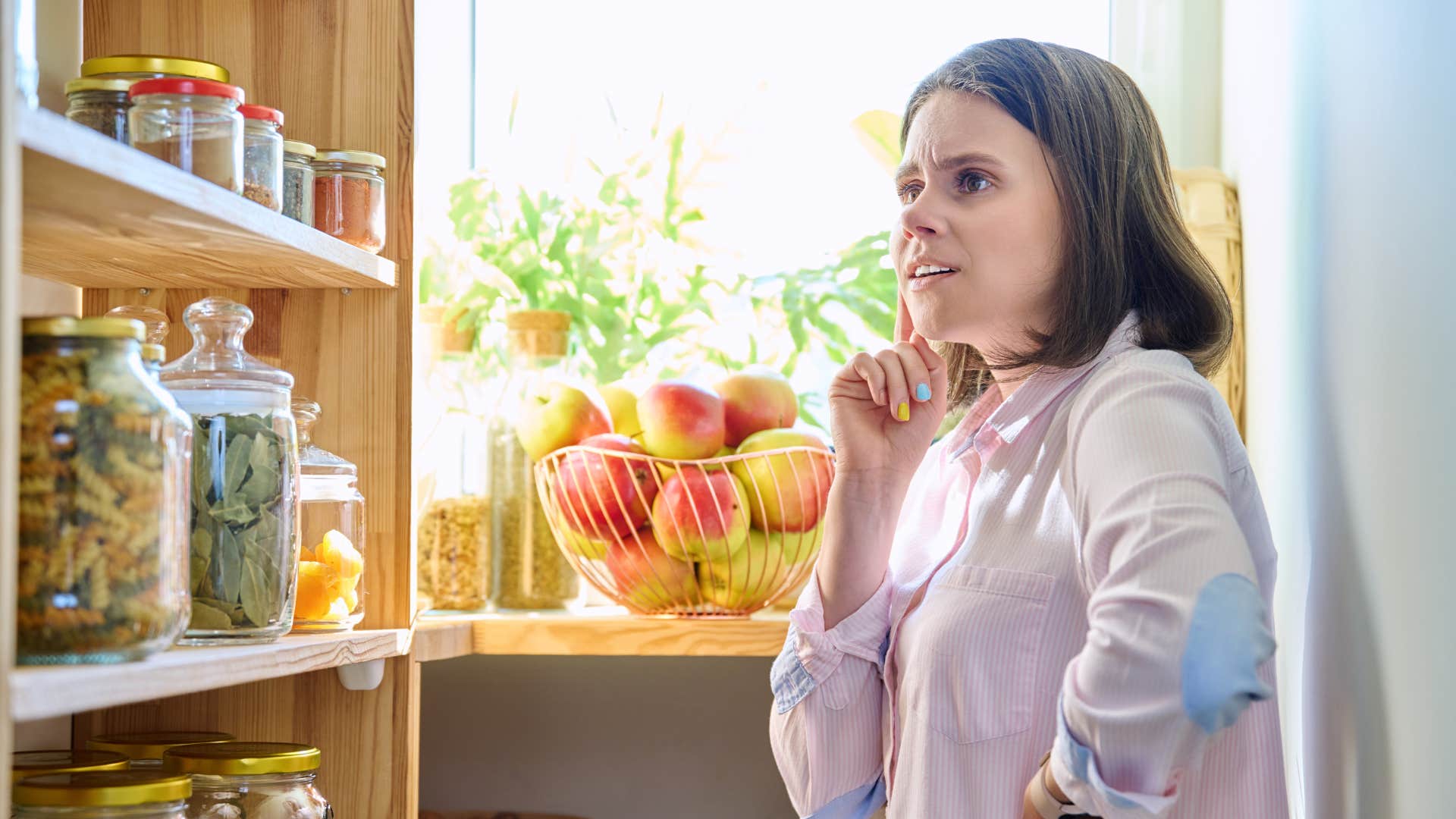 a frugal woman sees brand names and labels at her friends house