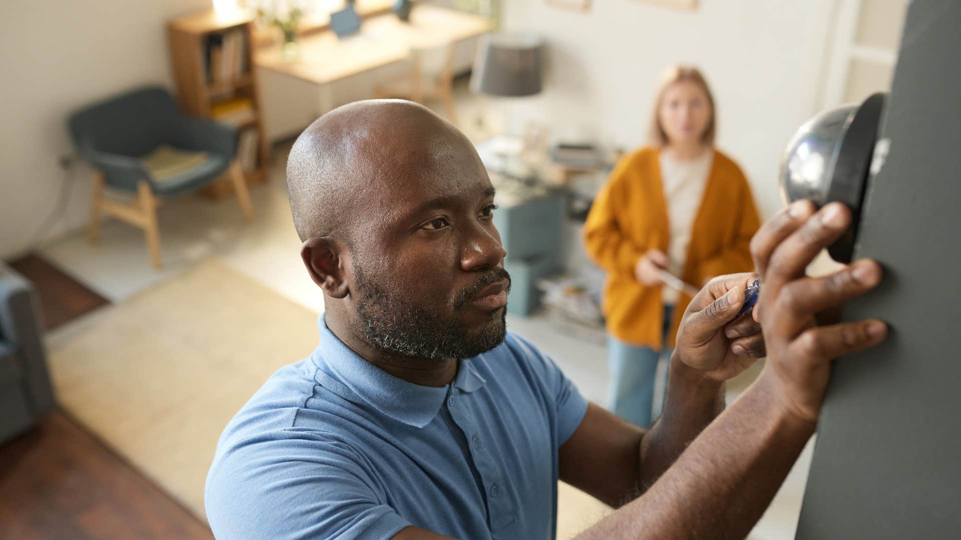 a woman wonders how much it costs to repair her friends in door security system