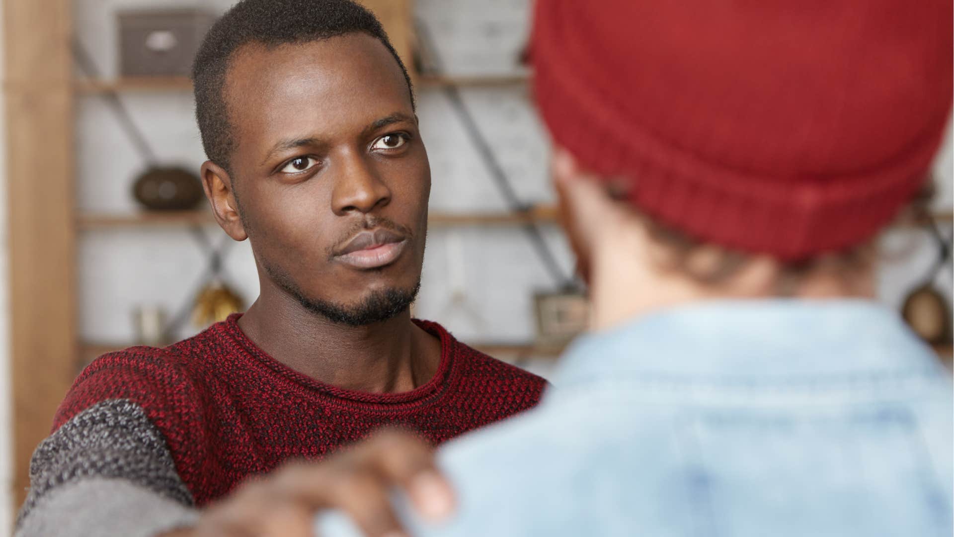 man who knows that setting boundaries isn't selfish putting his hand on a friend's shoulder