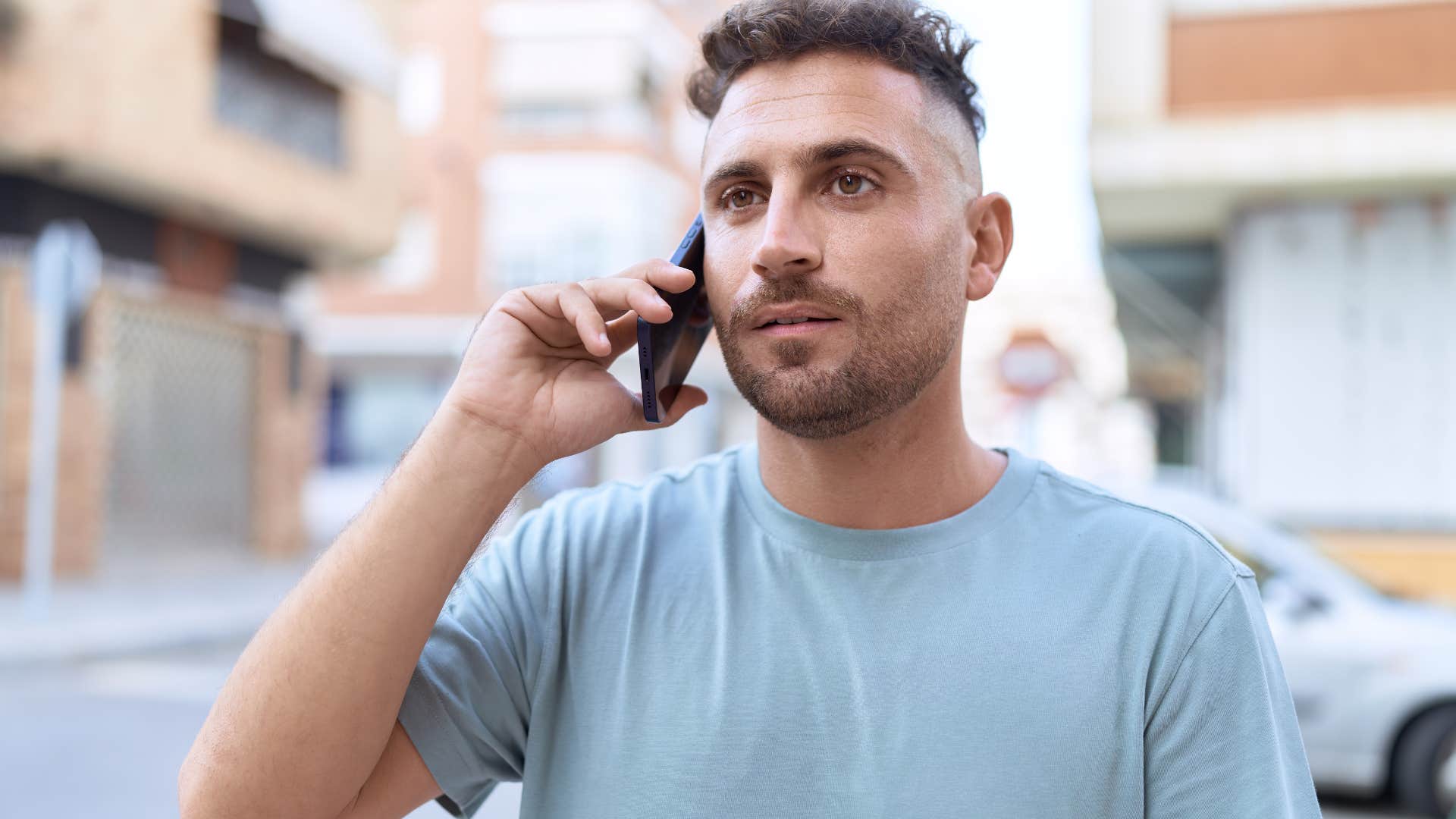man talking on the phone about how emotional labor can be taxing