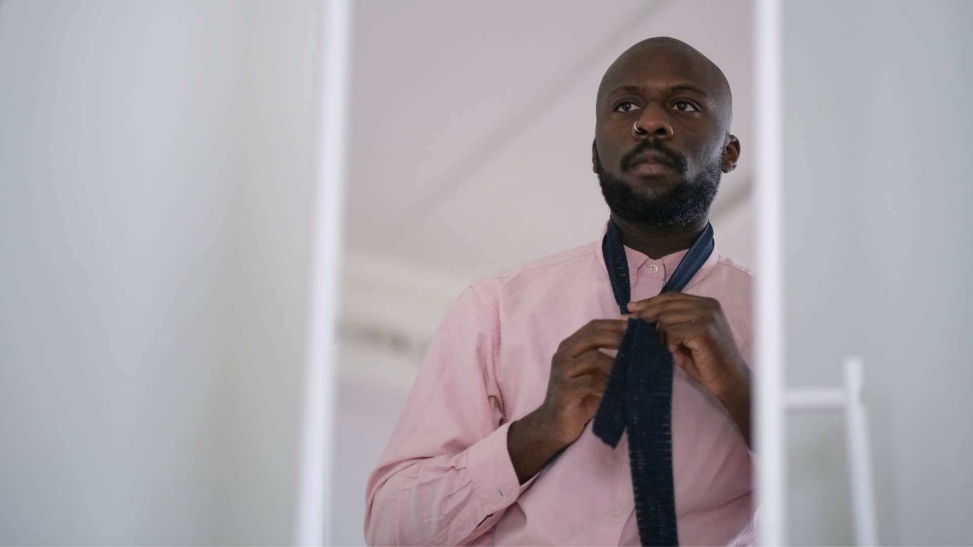man getting dressed up for special occasion
