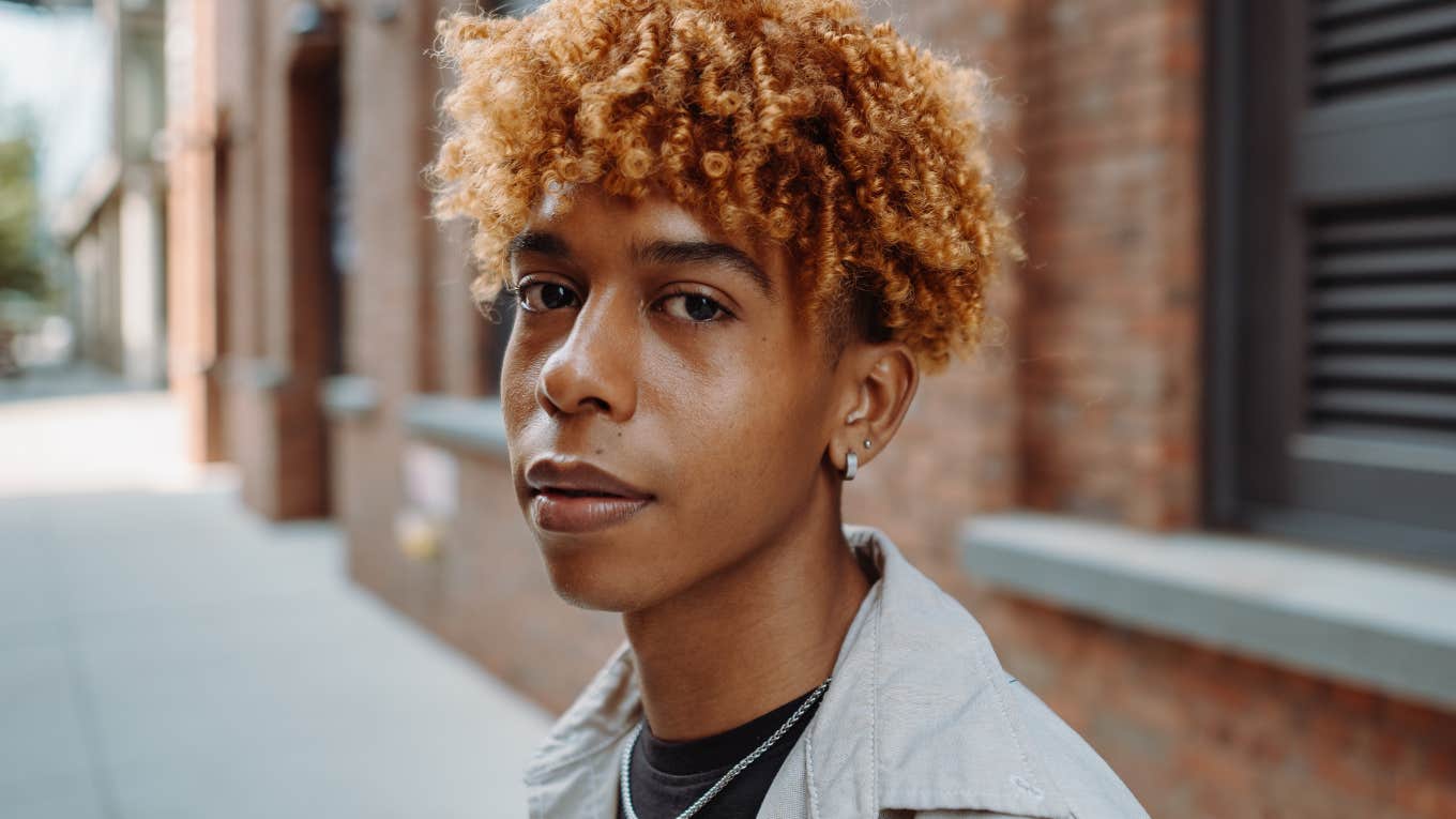 Things Gen Z Men Don't Seem To Know How To Do Anymore young gen z man smiling slightly