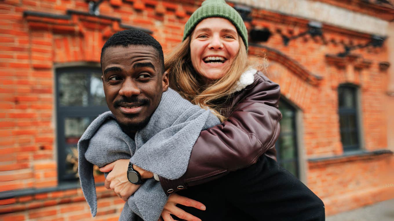 TK Things The Happiest Couples Do Differently, According to Research Happy couple laughing together.