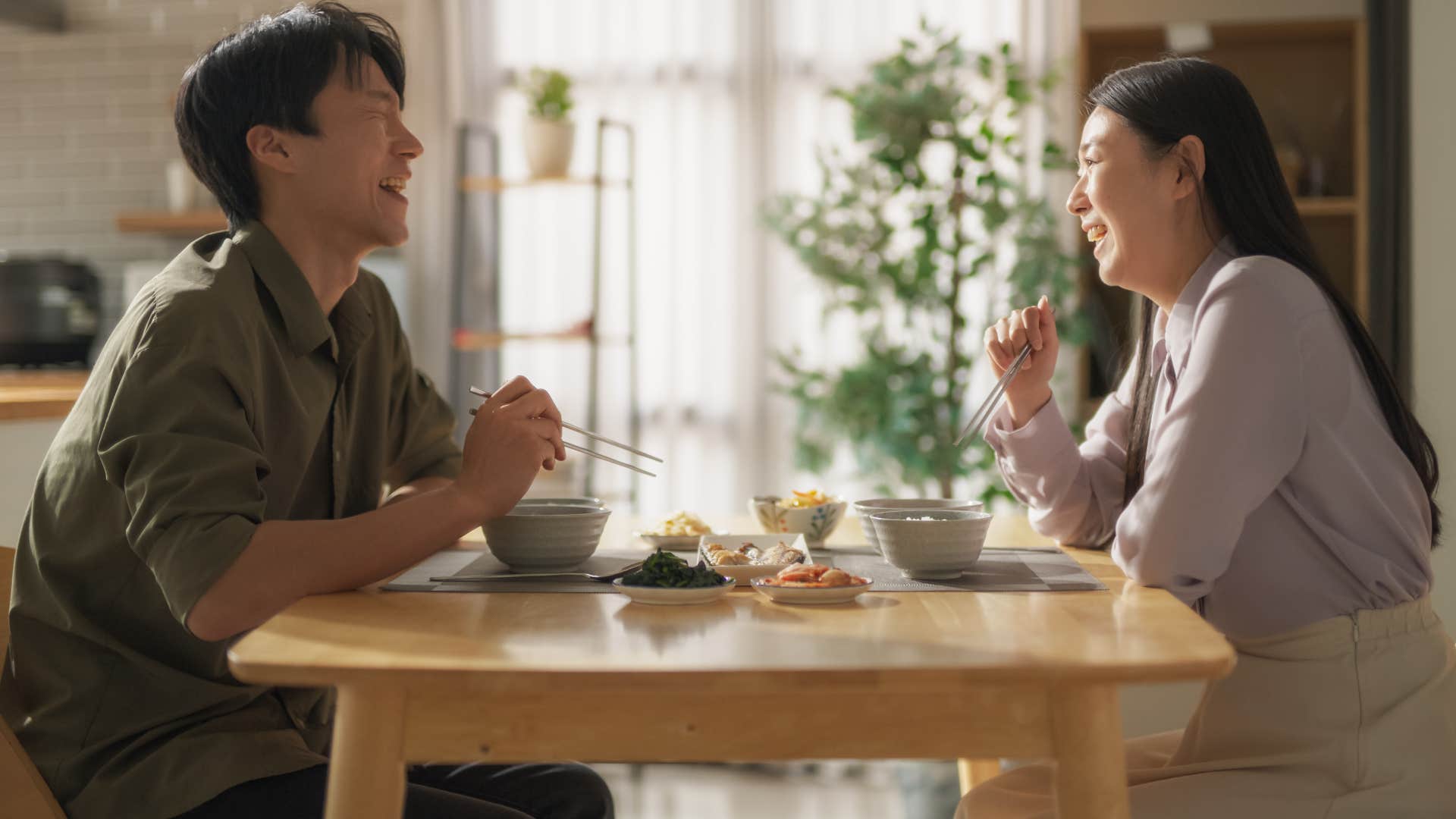 happy couple having breakfast before 9 AM