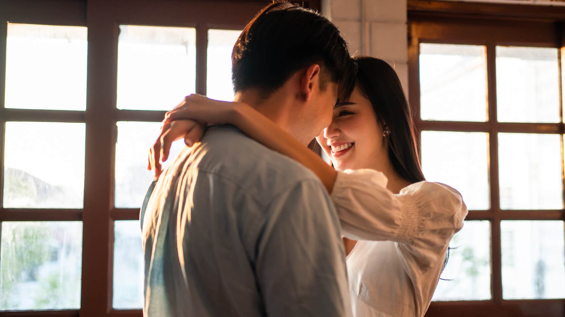 happy couple saying goodbye with intention before 9 AM