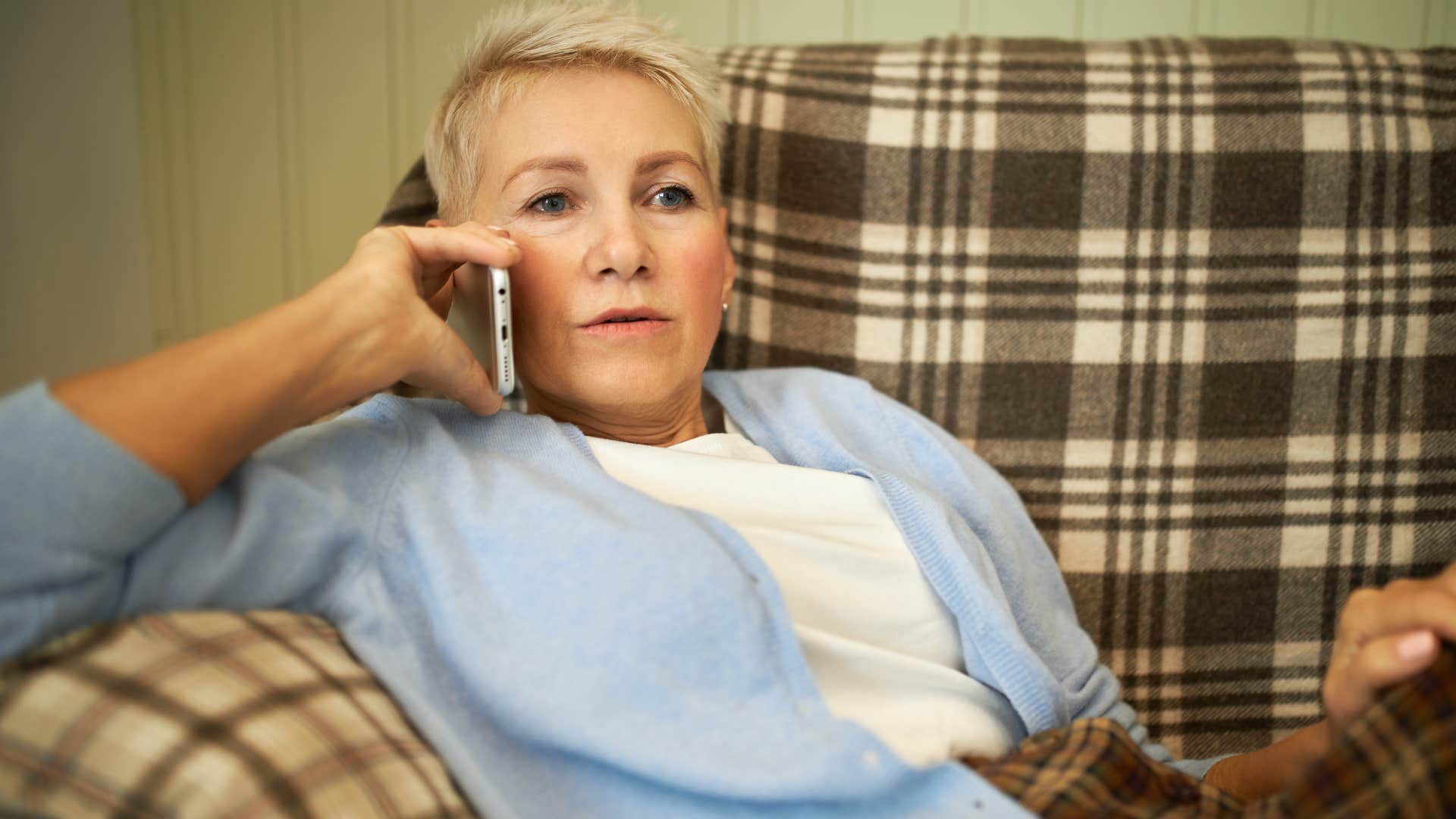 flaky woman talking to someone on the phone