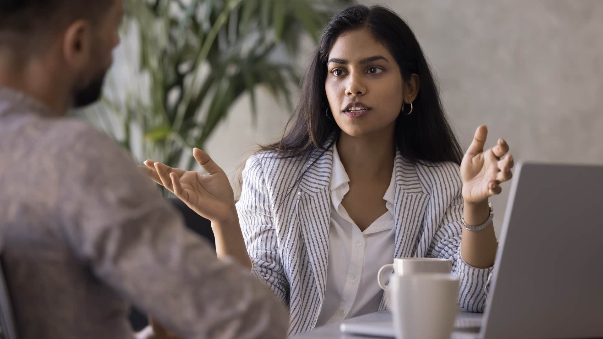 woman who is always in her comfort zone talking to co-worker