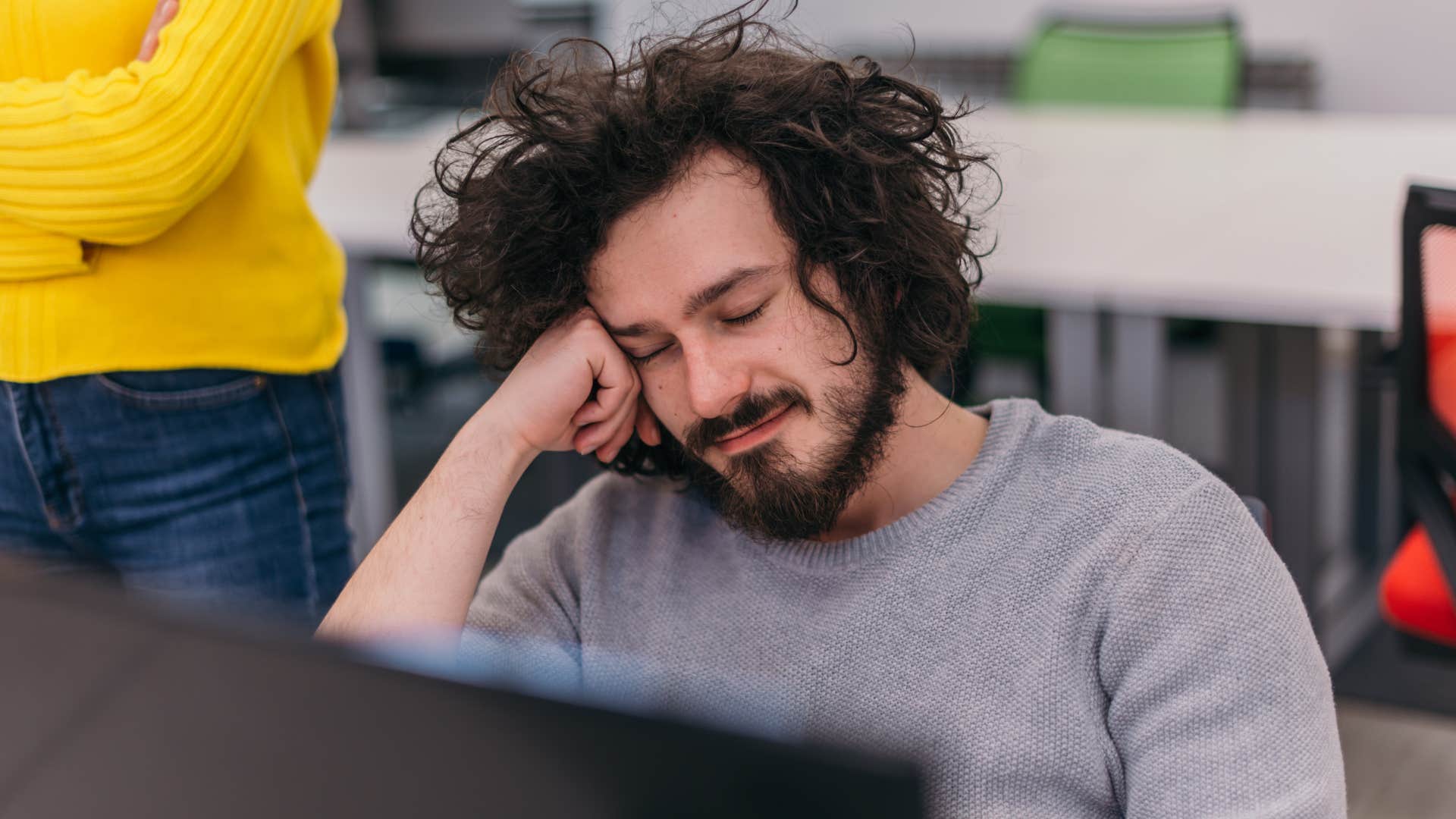 lazy man who never takes initiative sitting at his desk