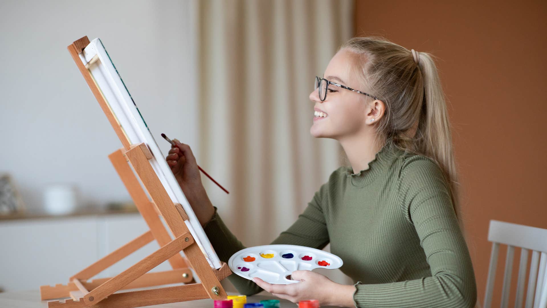 high IQ woman who is mastering a skill painting