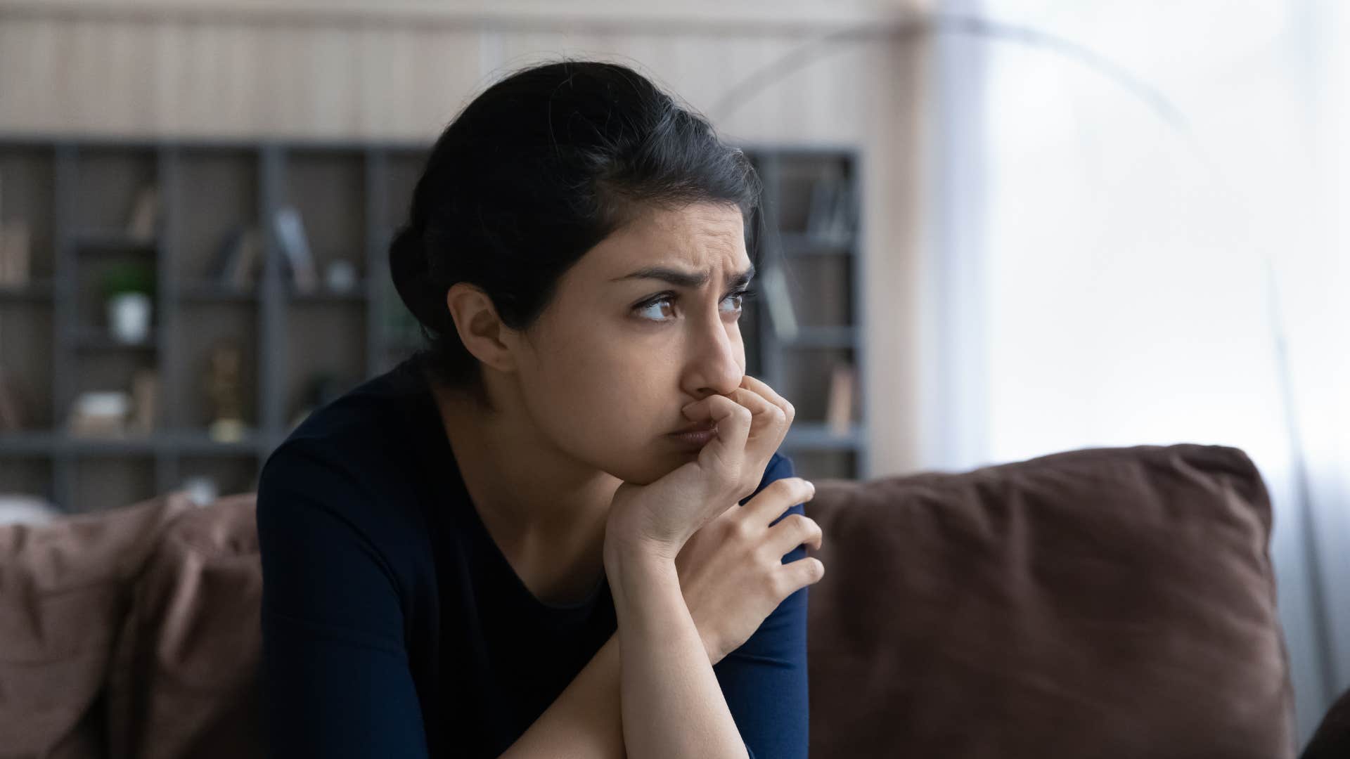 intelligent woman who is reconsidering her own beliefs