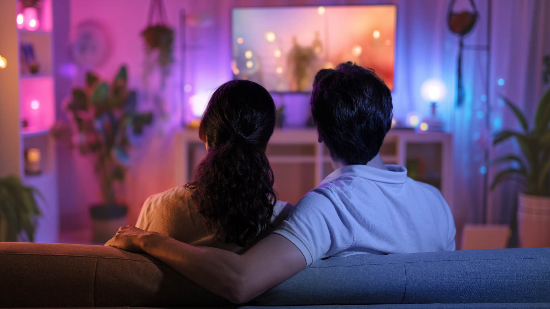man bonding with highly sensitive wife by watching tv together