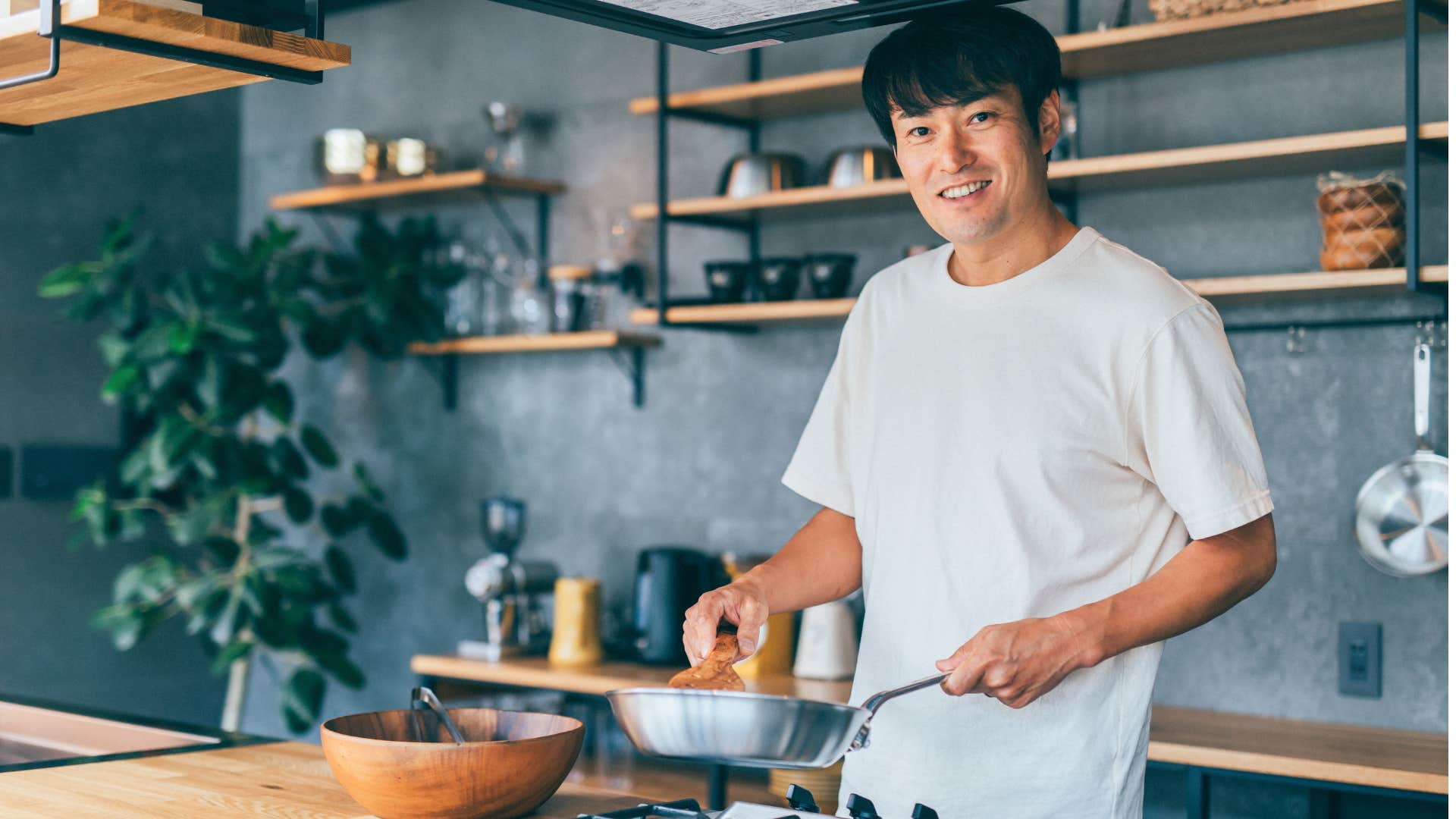 Man cooks in comfortable home