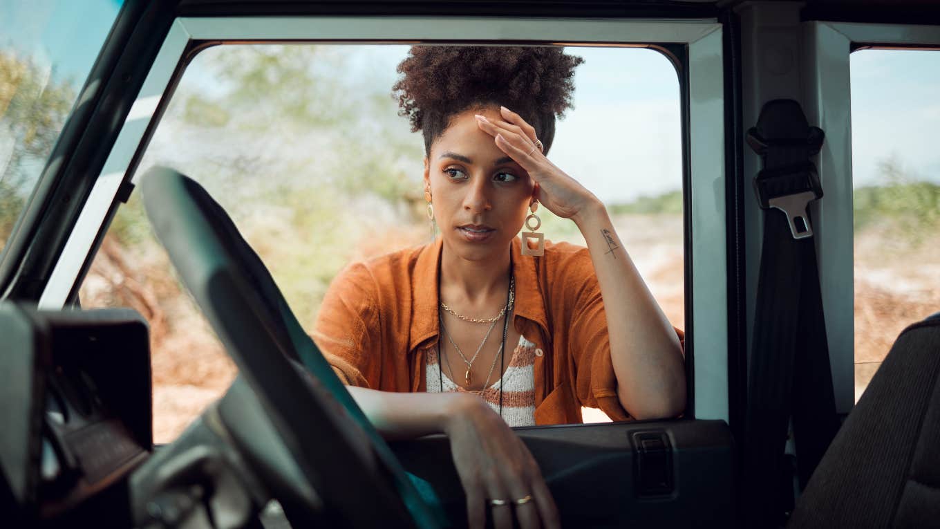 Things That Immediately Make People Feel Uncomfortable In Someone Else's Car woman looking uncomfortable about to get in a car