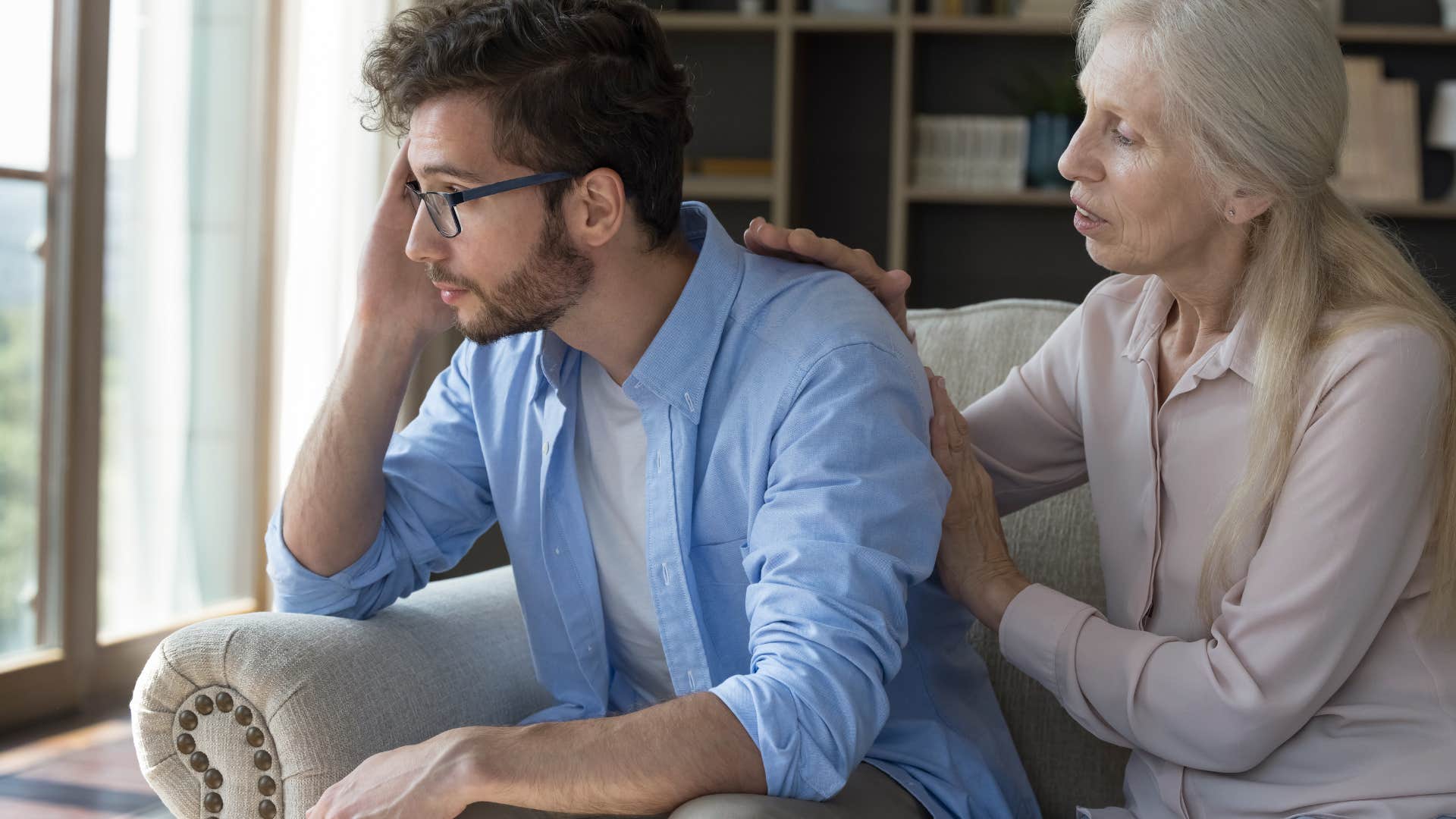 Upset woman saying "When are you going to grow up?" to her adult son.
