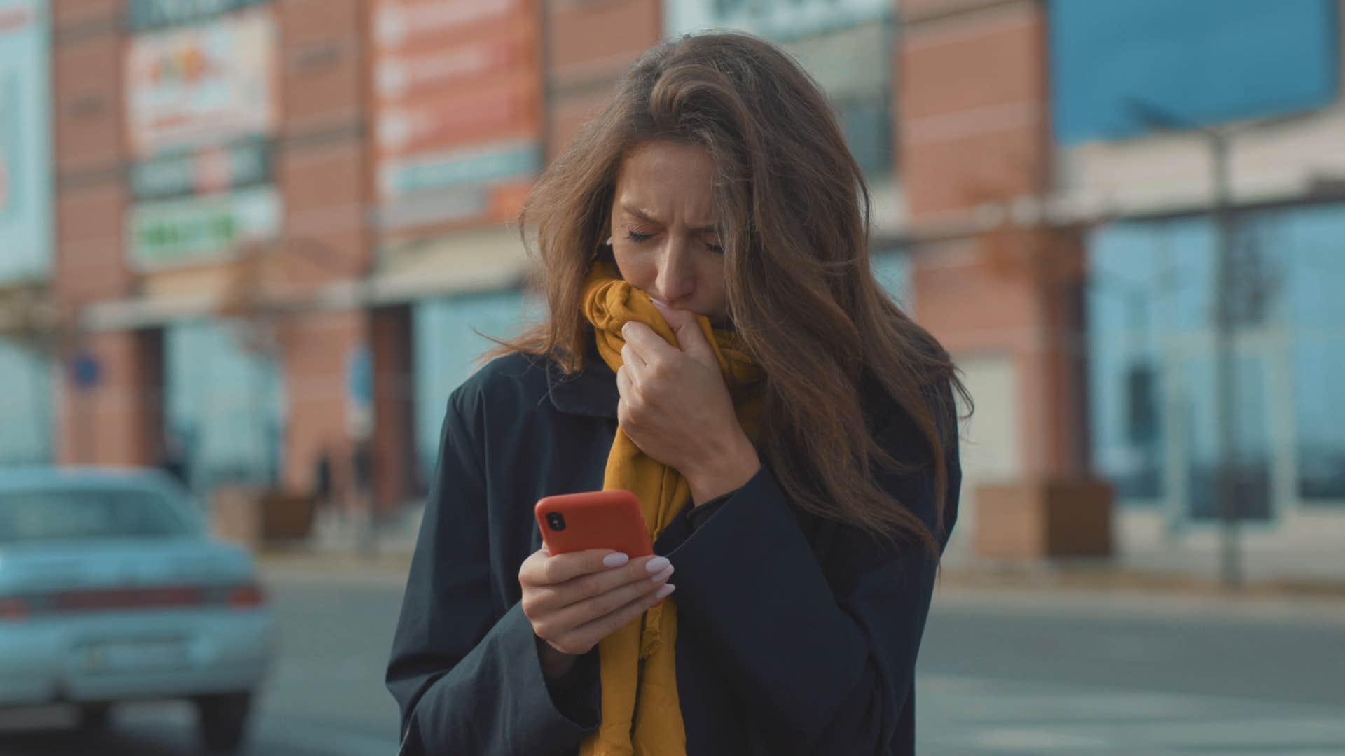 upset woman deleting her social posts