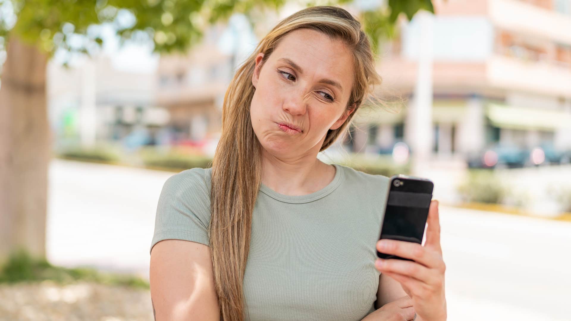woman getting upset that friends don't like her social media content