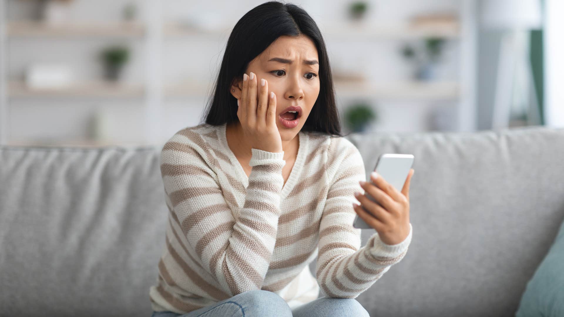woman obsessing over ex's photos on social media