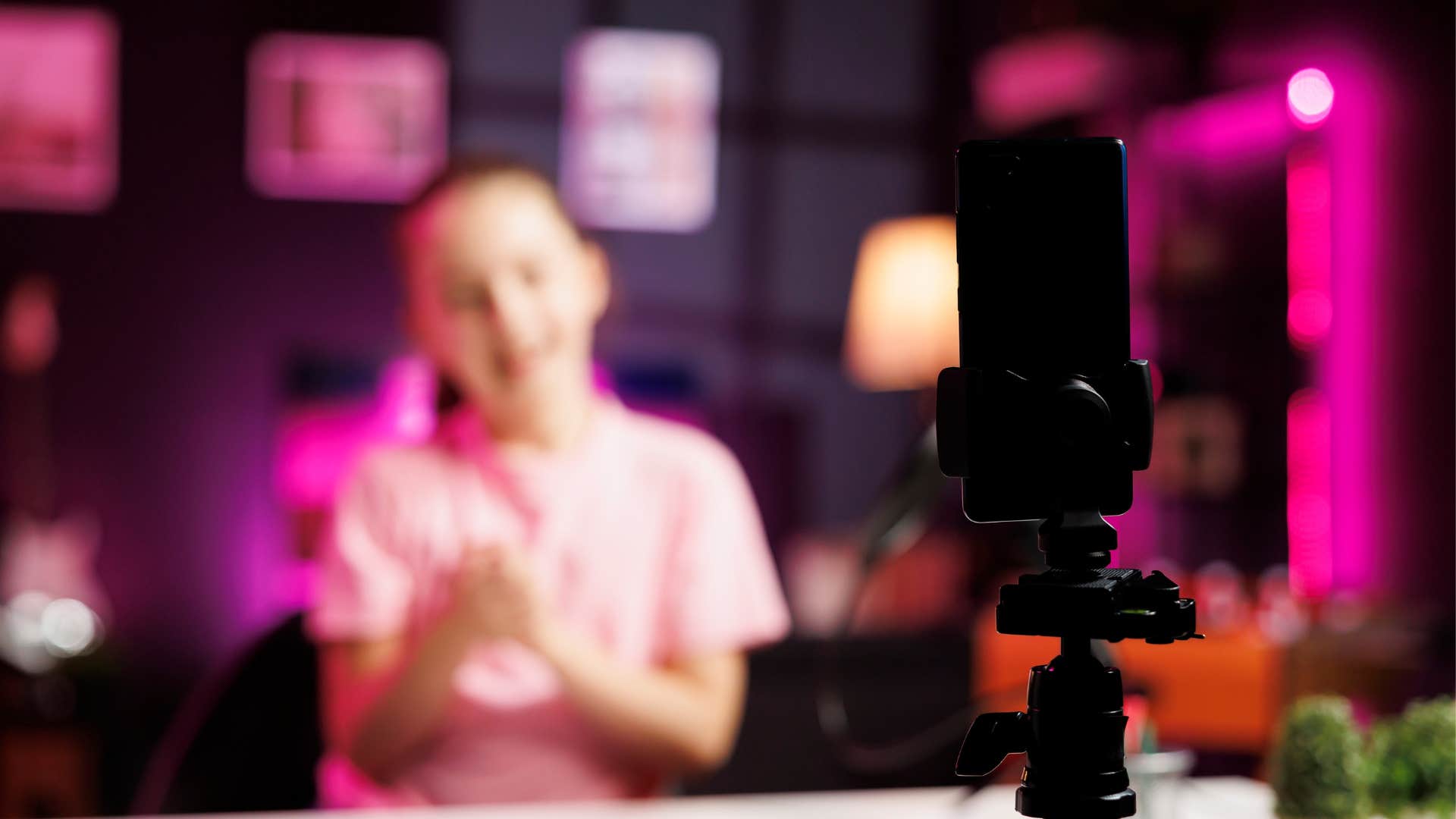 young girl in front of a microphone to film content