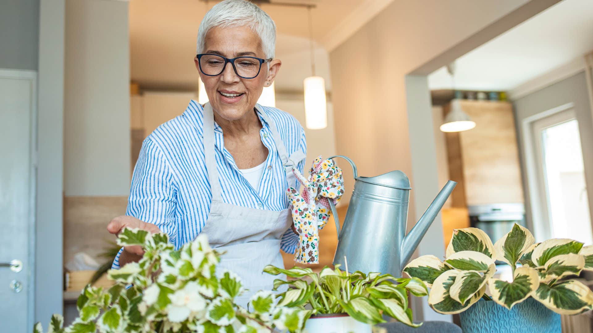 wealthy woman watering flesh flowers and plants
