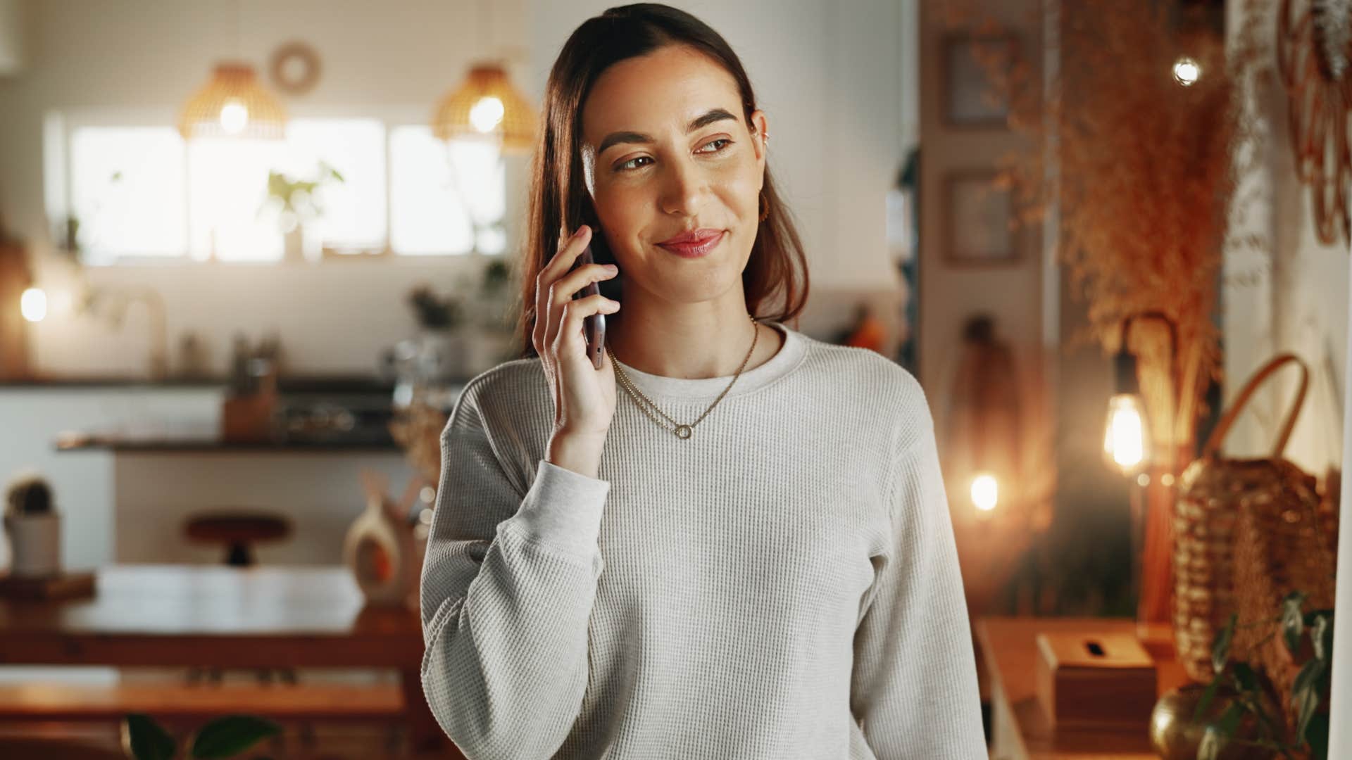 woman talking on the phone surrounded by quiet luxury