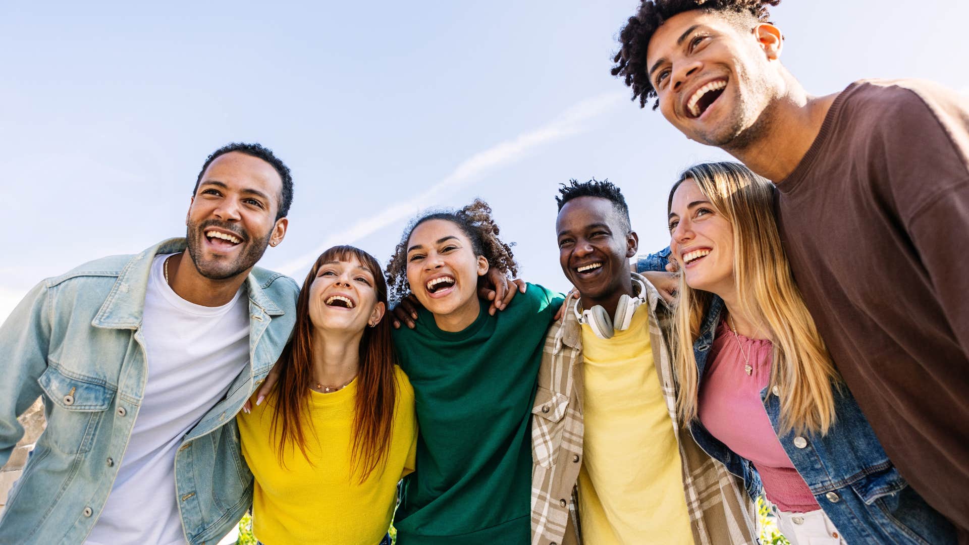 man with high self-esteem surrounded by positive people