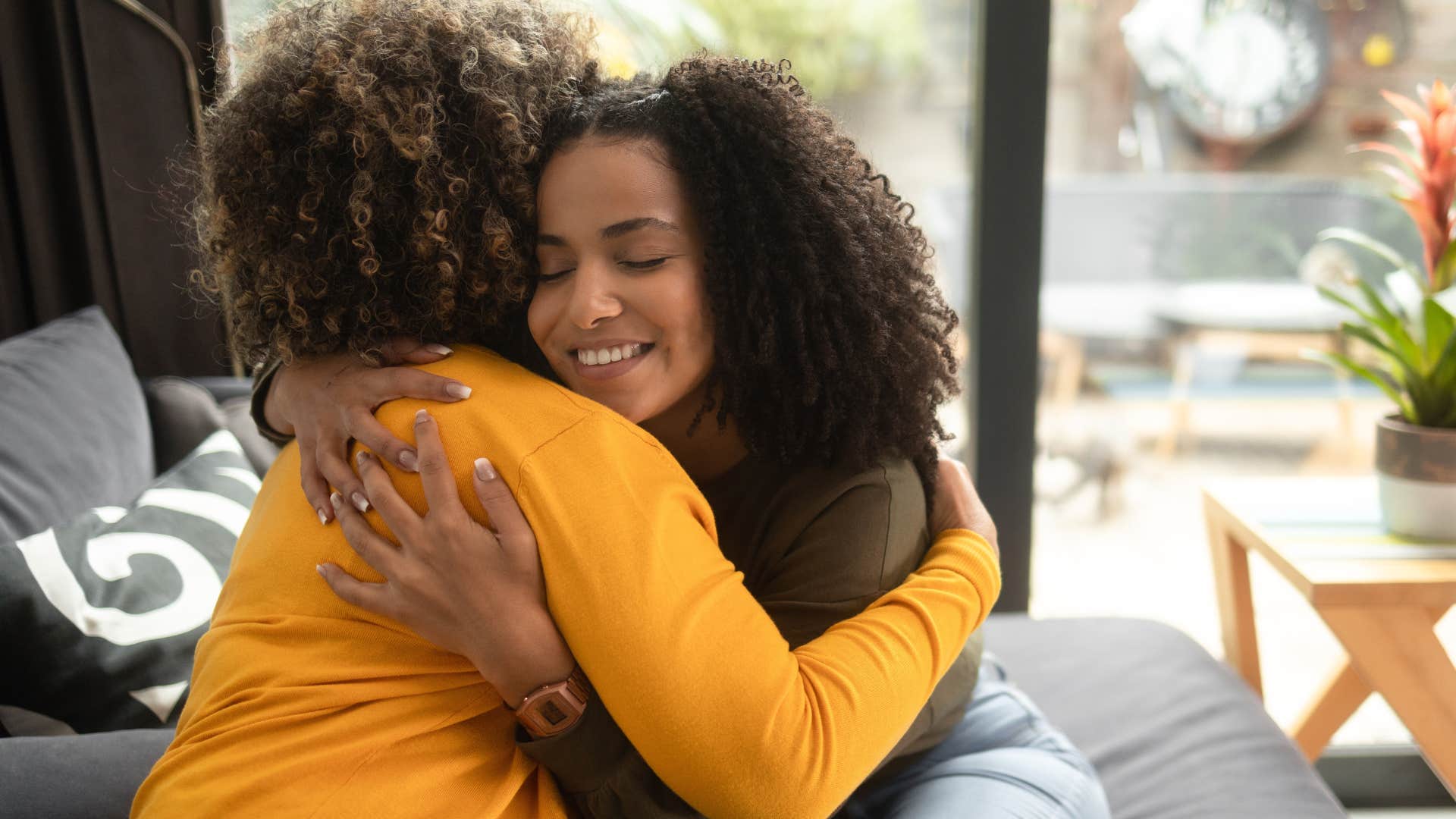 Woman who can embrace casual vulnerability hugging her friend.