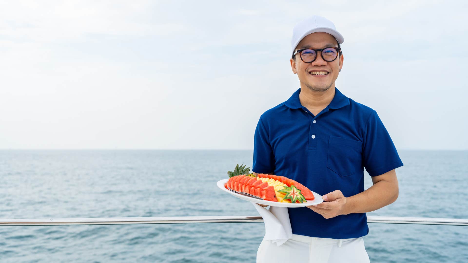 southern man bringing fruit to a boat party