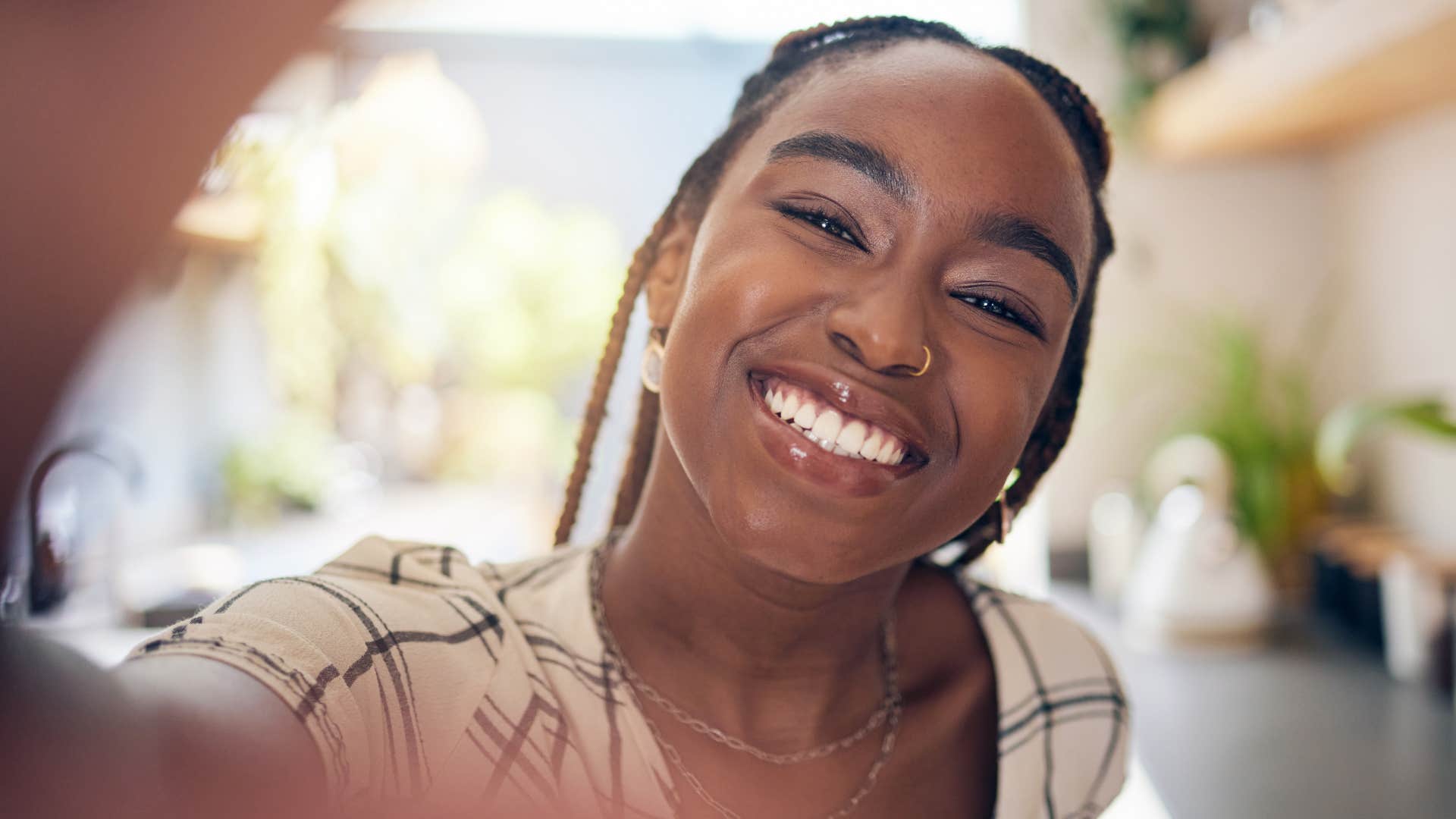 Woman who appreciates their alone time smiling at the camera.
