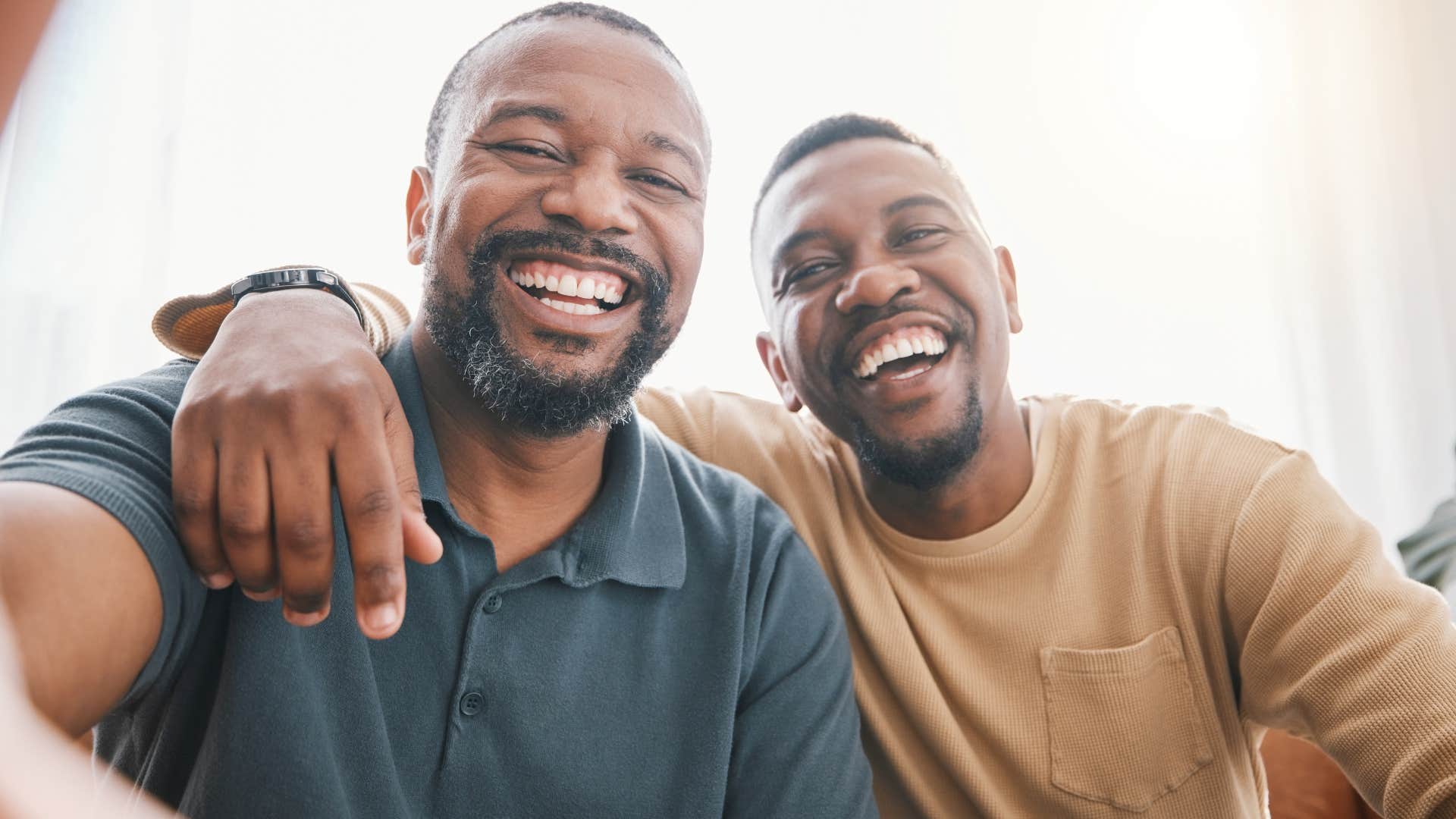 Man who has strong friendships hugging his friend.