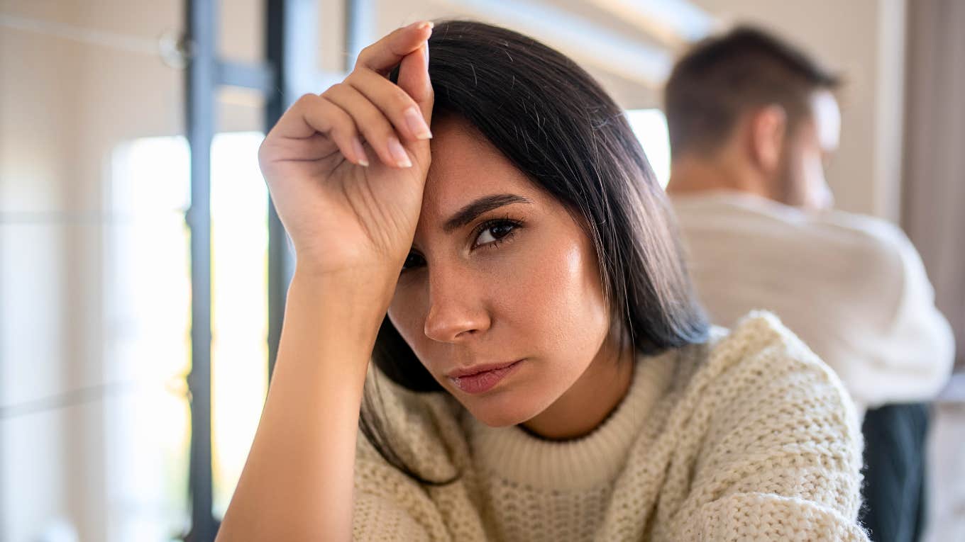 Things That Seem Classy But Instantly Make Normal People Feel Uncomfortable woman feeling uncomfortable with her hand on her head