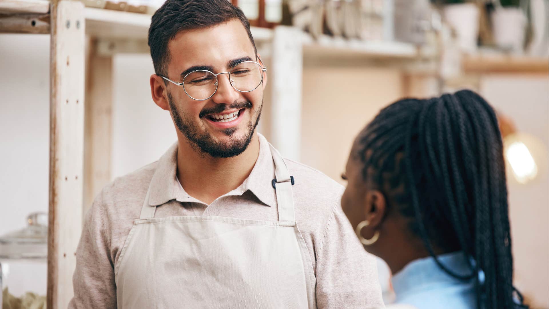 Woman giving every stranger a helping hand smiling at a man.