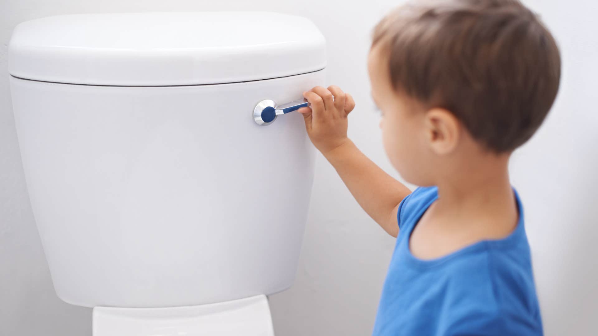 little kid flushing toilet leaving the seat open