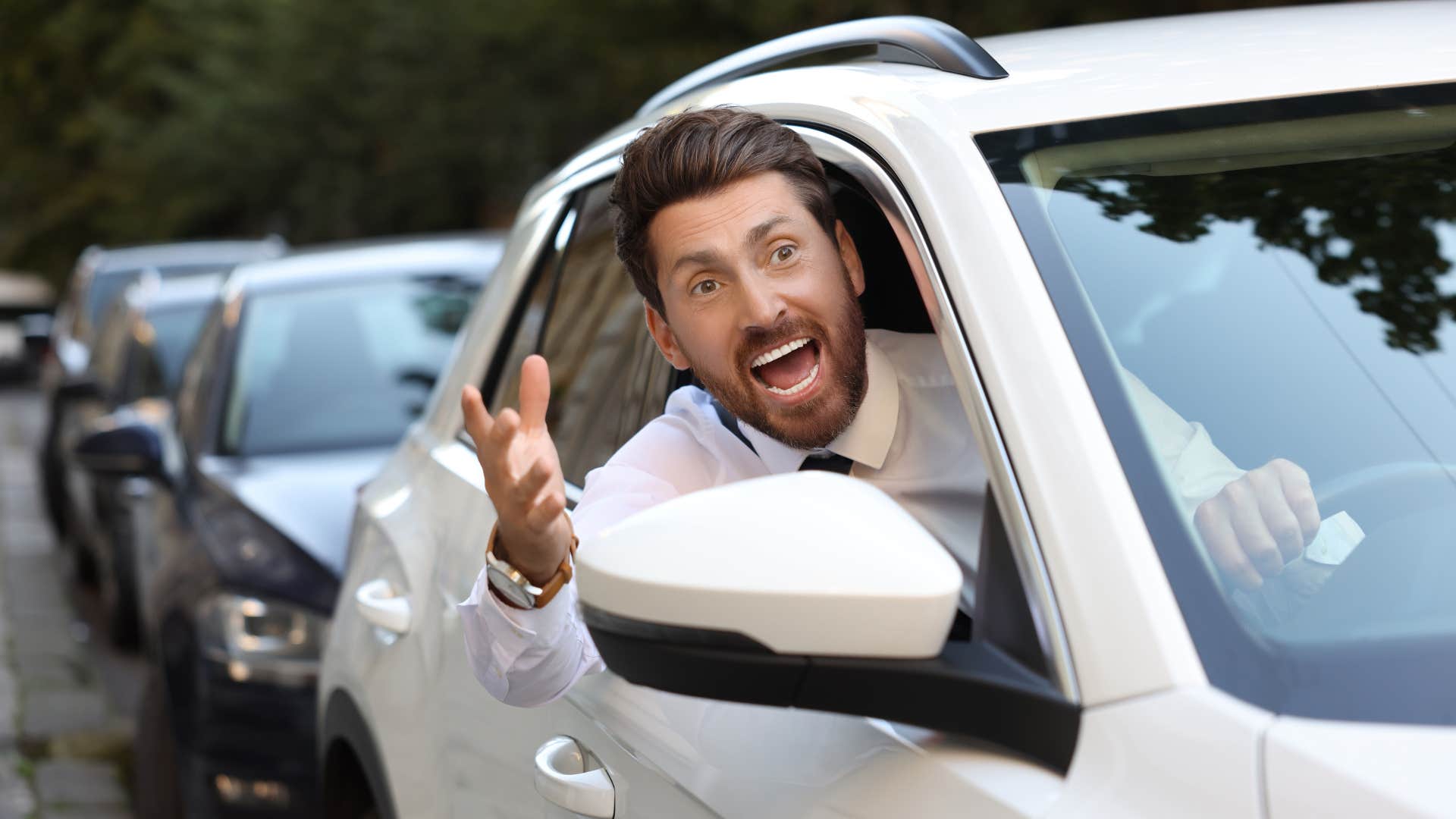 man who isn't a safe driver yelling at another car