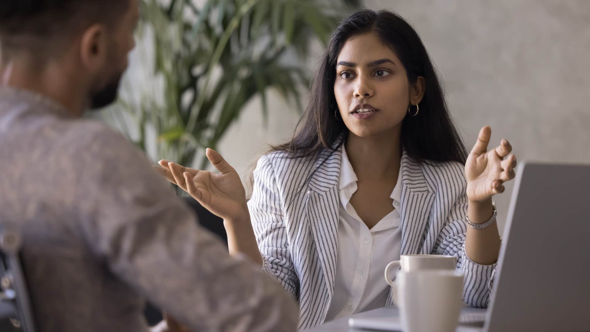 Woman talking about shortcuts with a peer.
