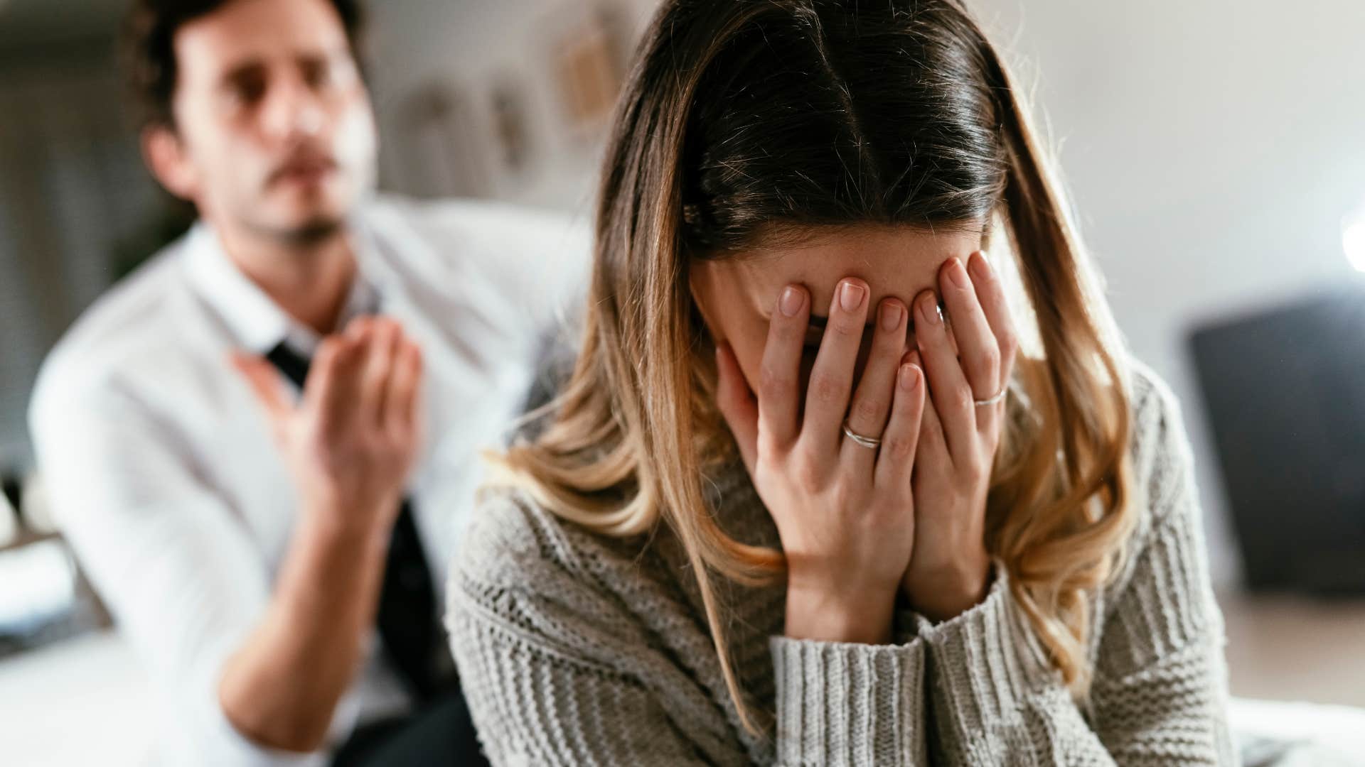 Woman with a victim mentality turned away from her upset partner.