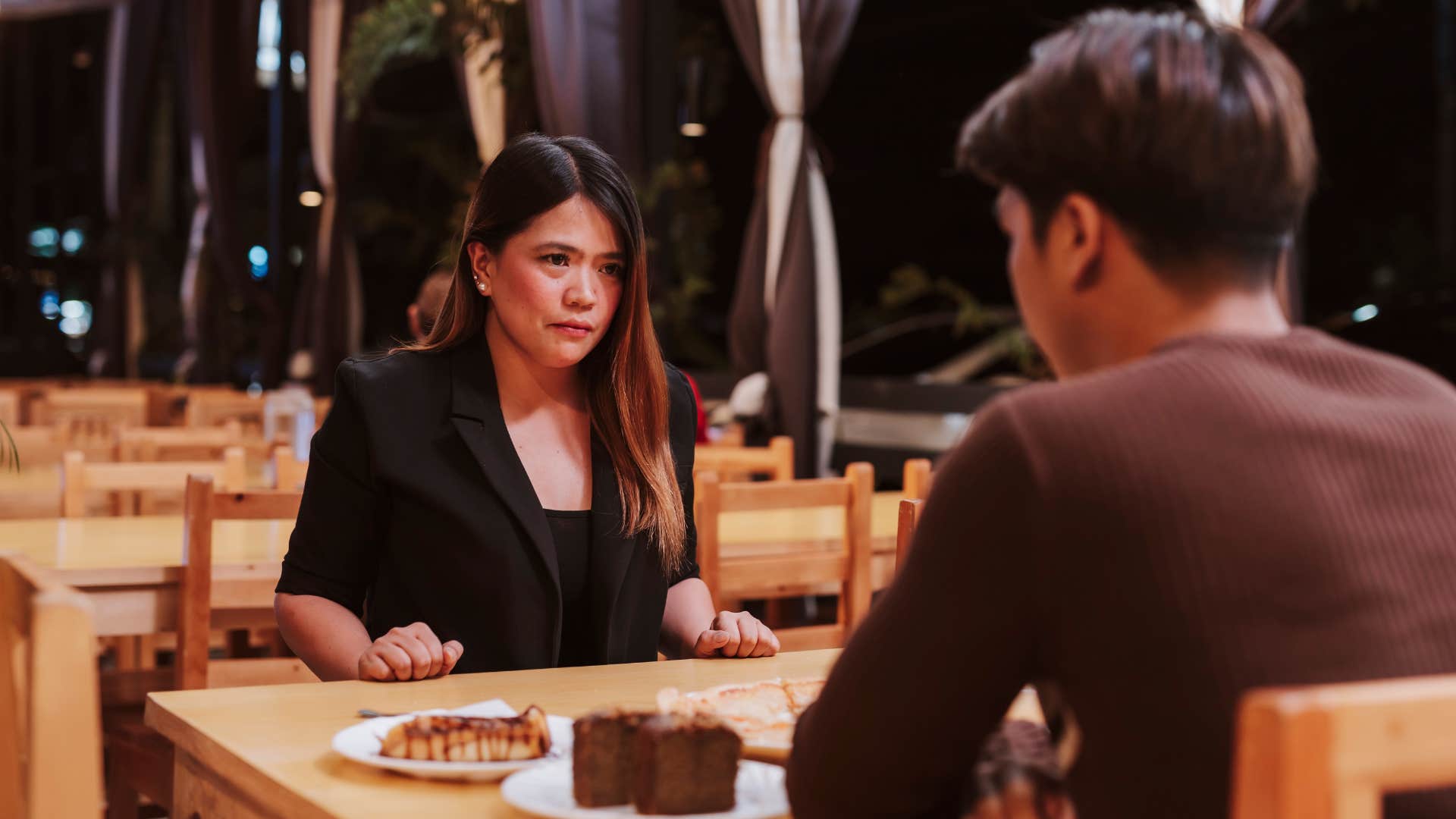 intelligent woman realizing man is faking a deep conversation
