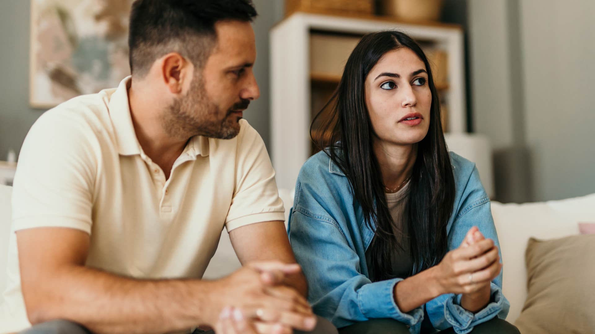 woman being judgmental sitting next to her partner