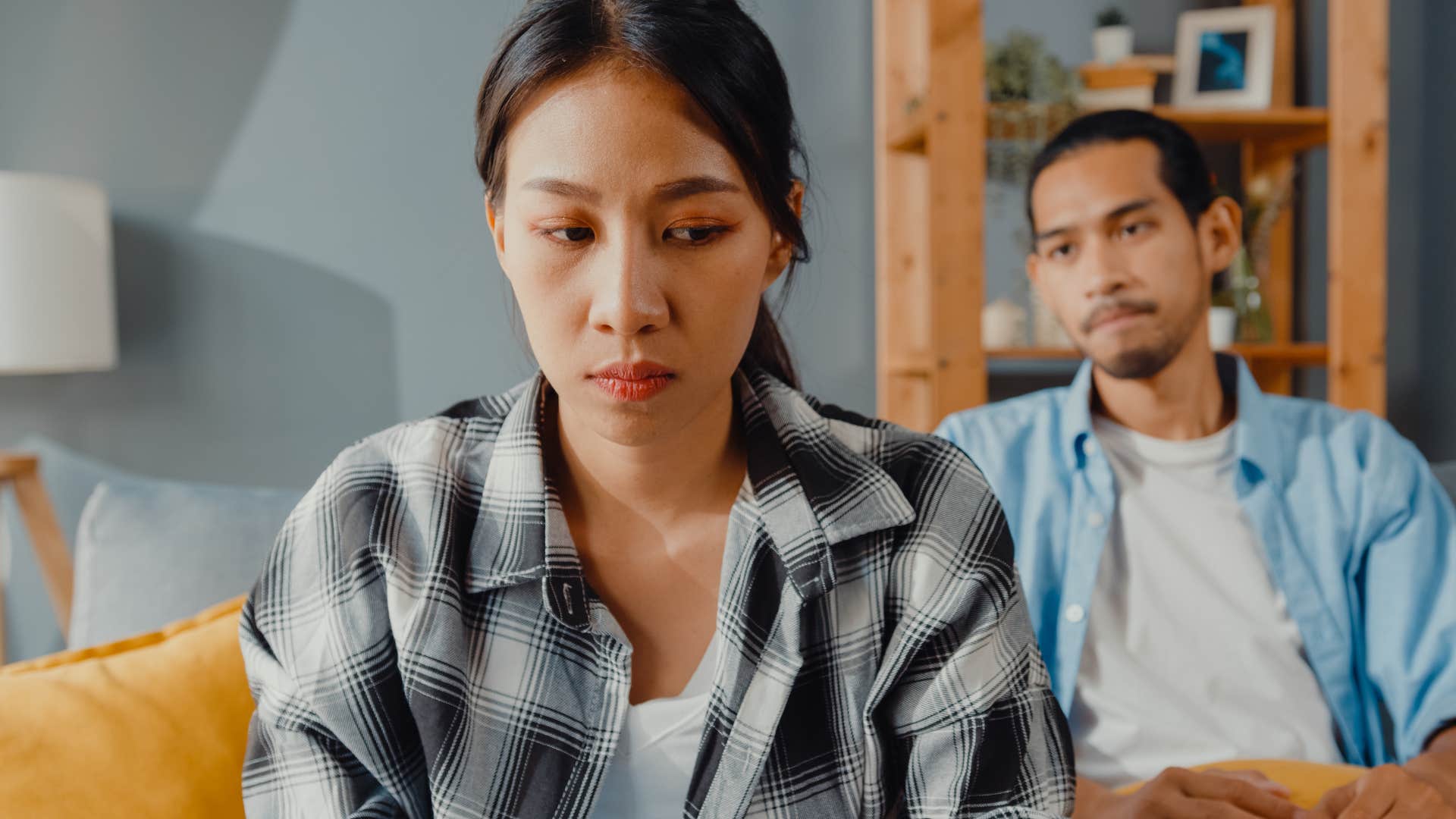unempathetic woman turned away from her partner