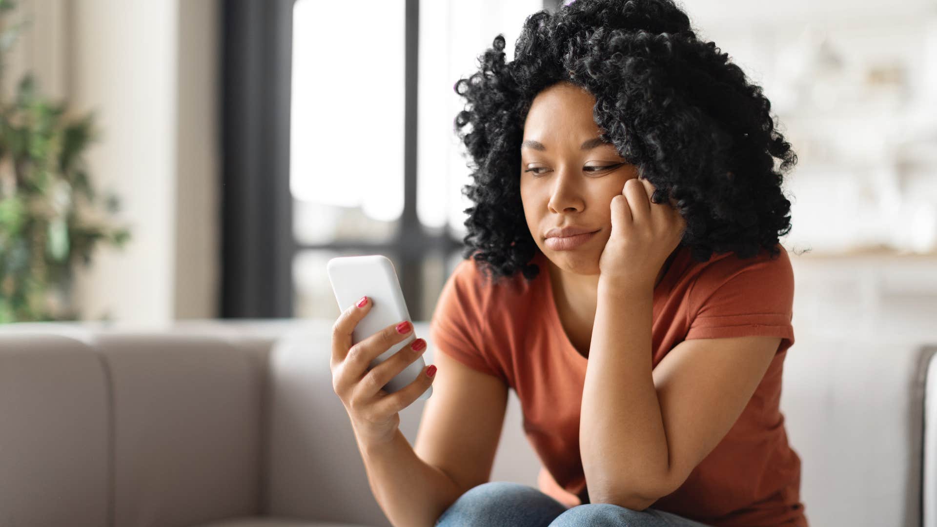 woman with poor habits and routines sitting on her couch