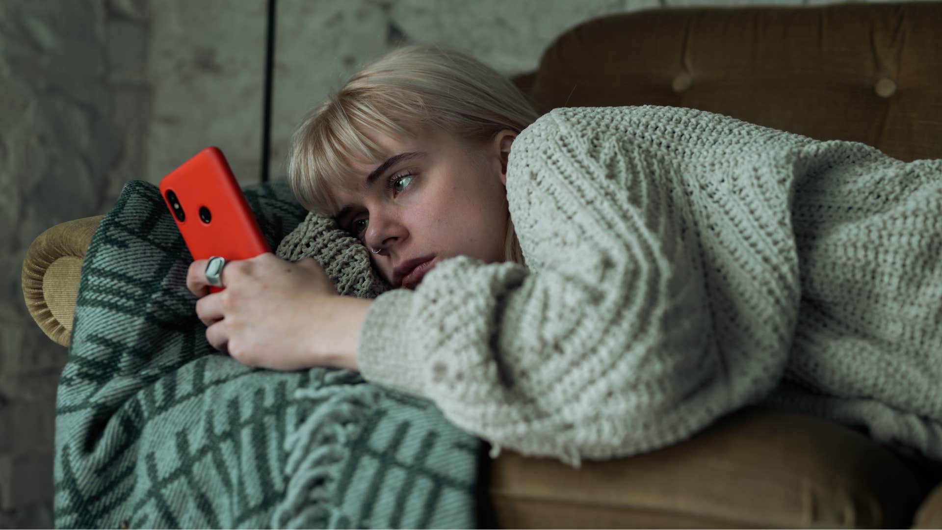 lazy woman refusing to change scrolling on her phone