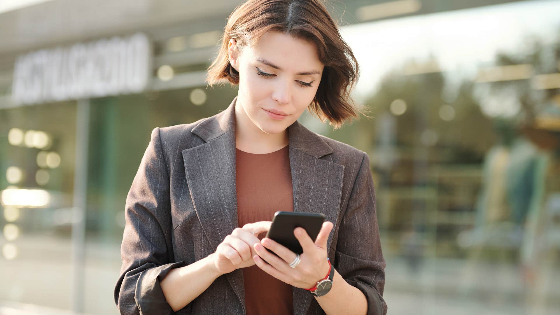 woman who endlessly follows trends scrolling on her phone